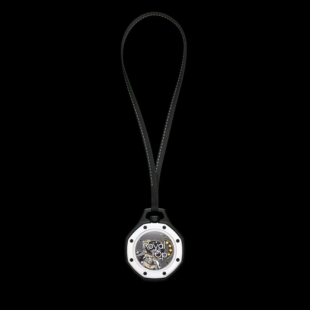 Swatch x Audemars Piguet Royal Pop Ocho Negro pendant watch with black textured dial and octagonal bezel on a black strap.
