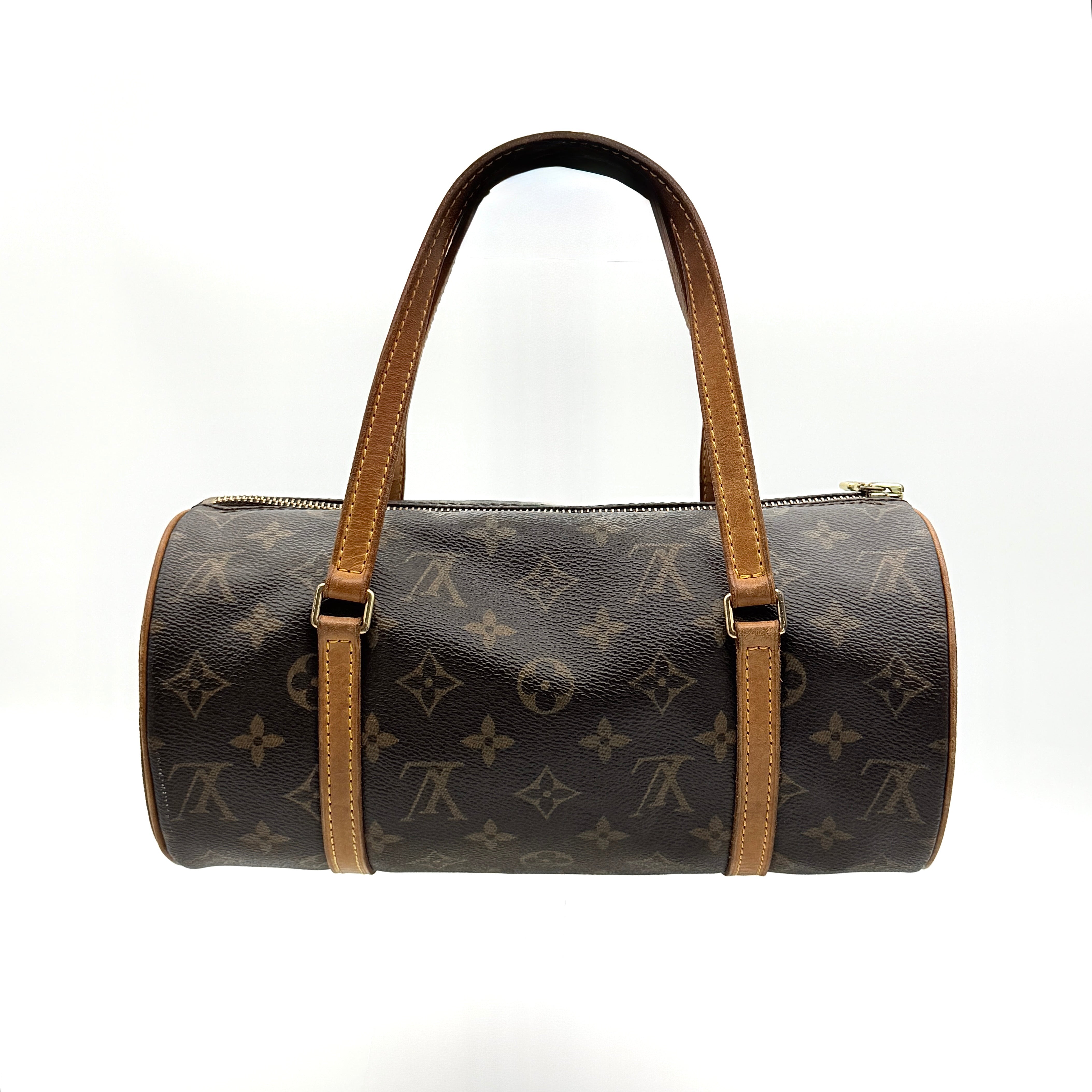 Louis Vuitton Papillon 26 in Monogram canvas with brown leather trim and gold-tone zip, shown against a white background.