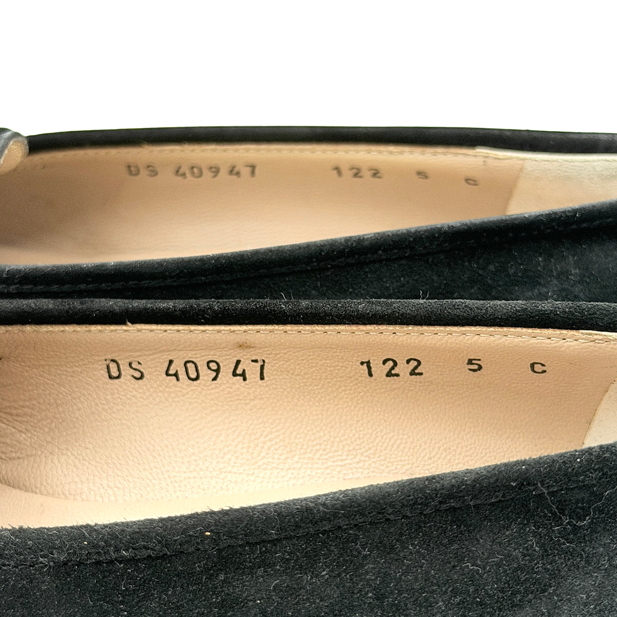 Salvatore Ferragamo black suede loafers with gold Gancini horsebit detail, displayed side by side on a white background.