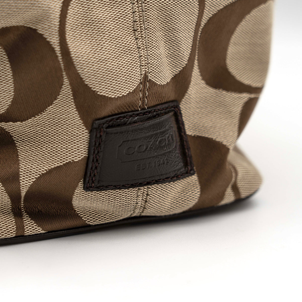 Coach Signature Stripe Frame Kisslock Shoulder Bag in beige and brown canvas with leather trim and signature monogram pattern.