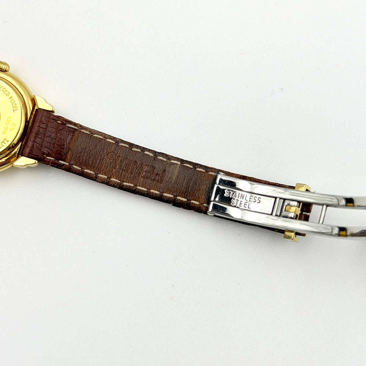 Fendi 350L Orologi Quartz Watch in gold with brown leather strap, displayed with original box and booklet.