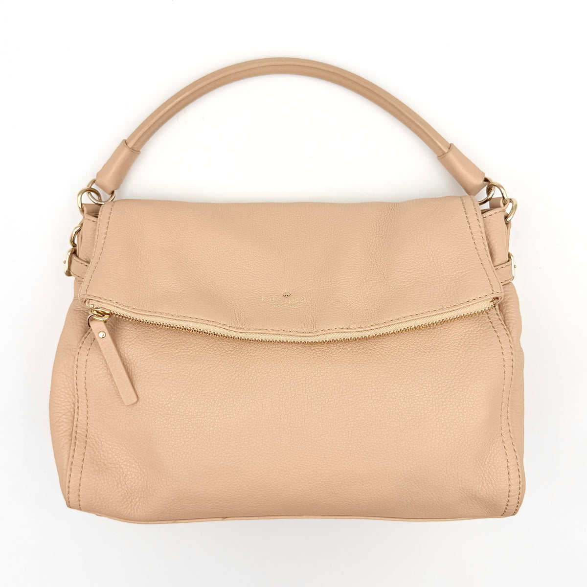 Kate Spade Cobble Hill Little Minka in beige pebbled leather with both top handle and detachable strap displayed.