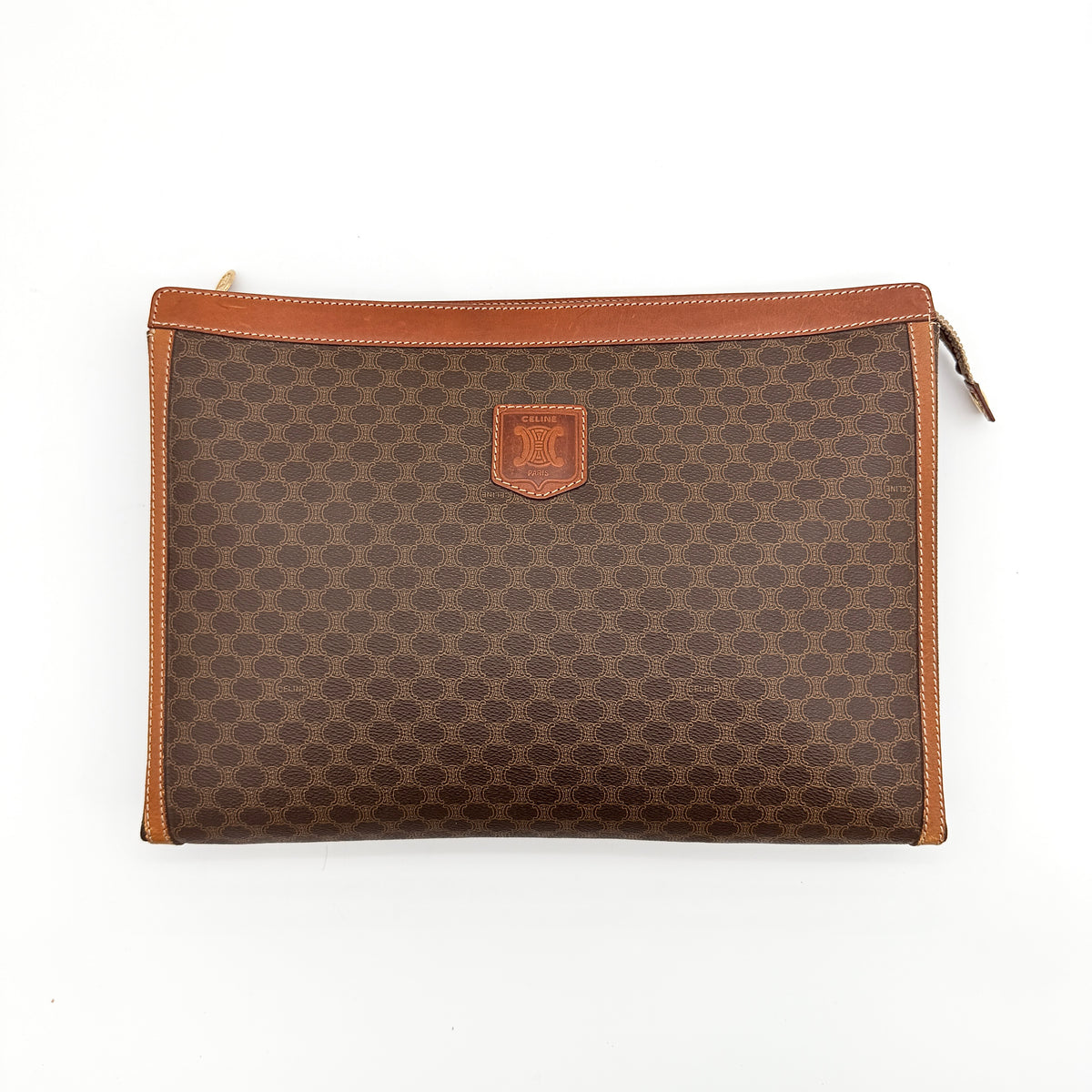 Celine Triomphe Macadam Clutch Bag in brown coated canvas with leather trim, shown against a white background.
