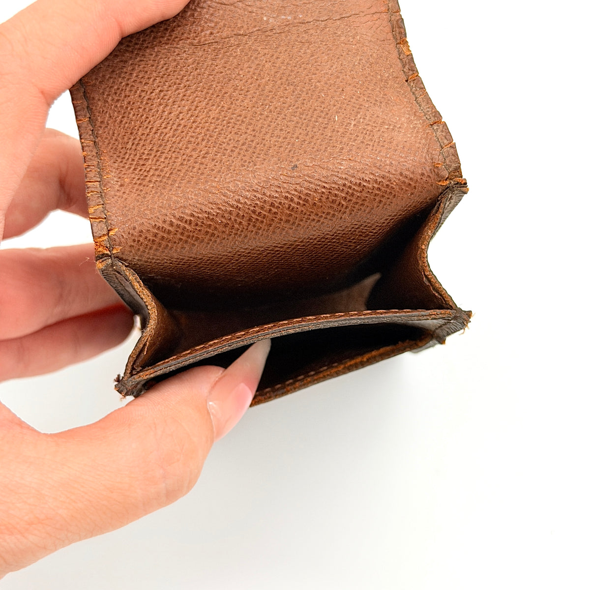 Louis Vuitton Monogram Cigarette Case in brown canvas with flap opening, photographed front-facing on a white background.