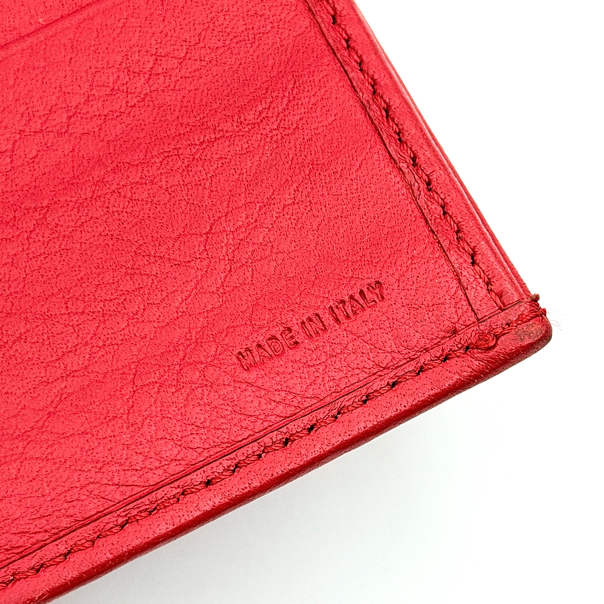 Fendi FF Logo Buckle Flap Continental Wallet in red leather with gold hardware, displayed closed on a white background.