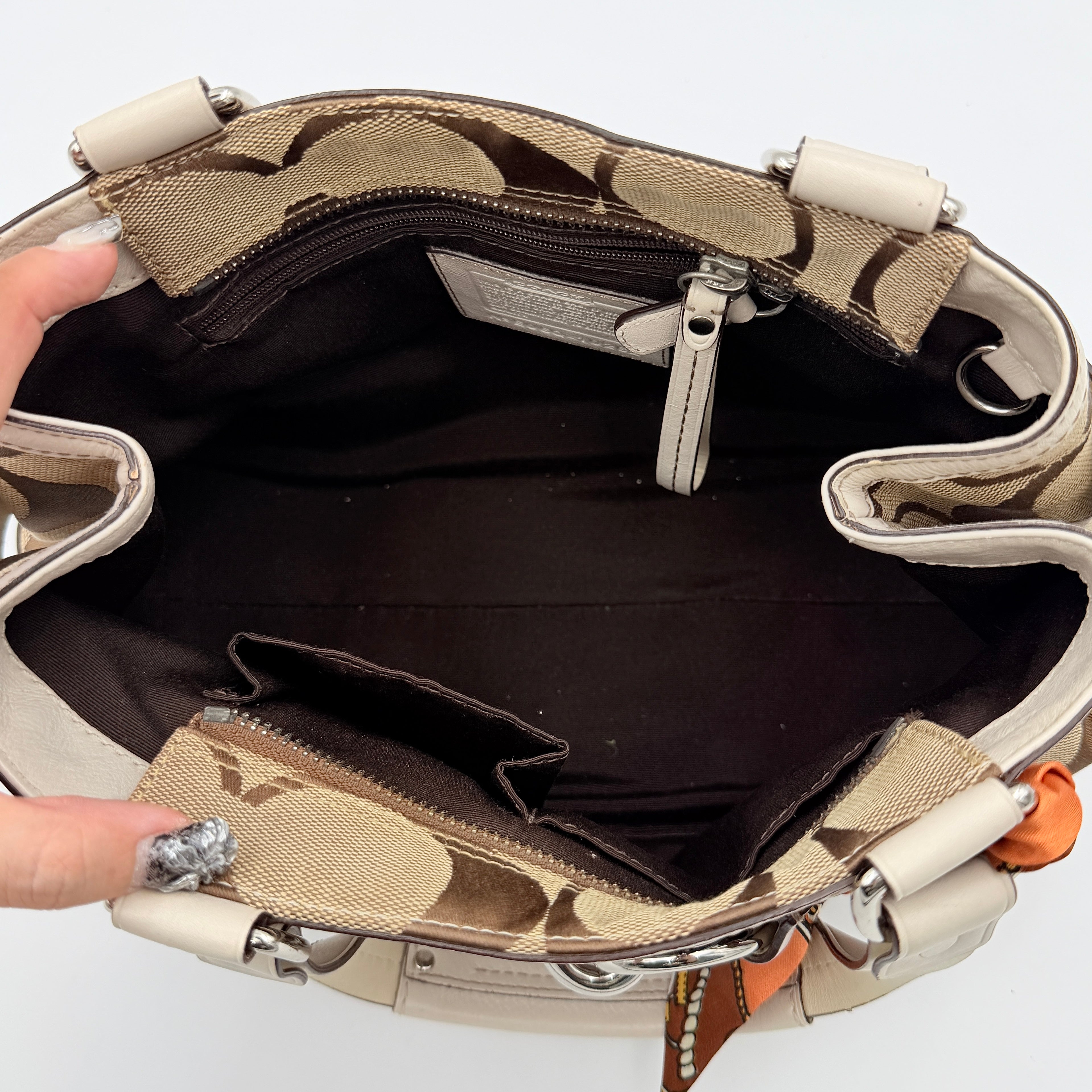Coach Signature Hampton Python Stripe Handbag in multicolour leather and canvas with silver-tone hardware and an orange scarf detail.