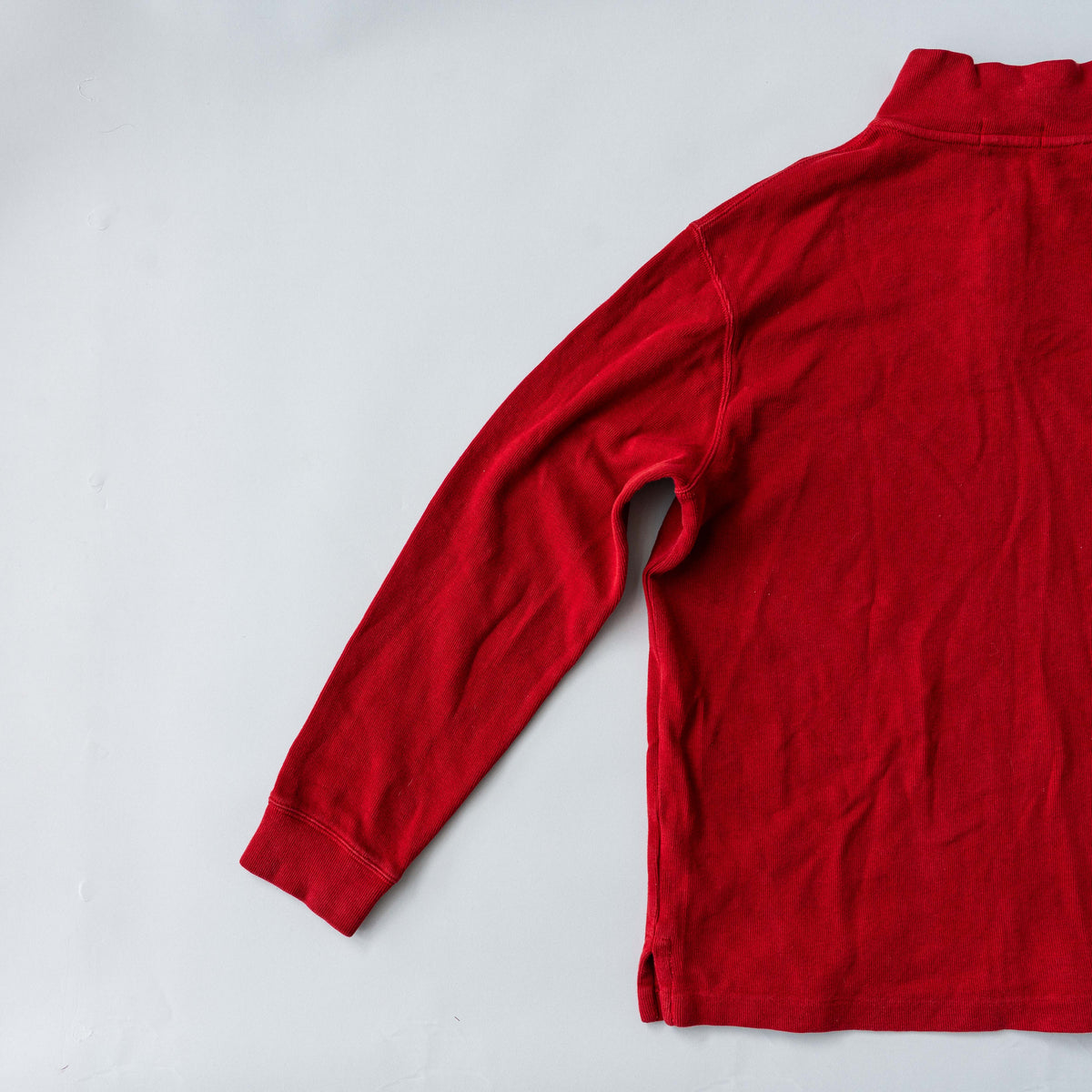 Polo Ralph Lauren red quarter zip mockneck pullover sweater with navy pony embroidery, laid flat on a white background.
