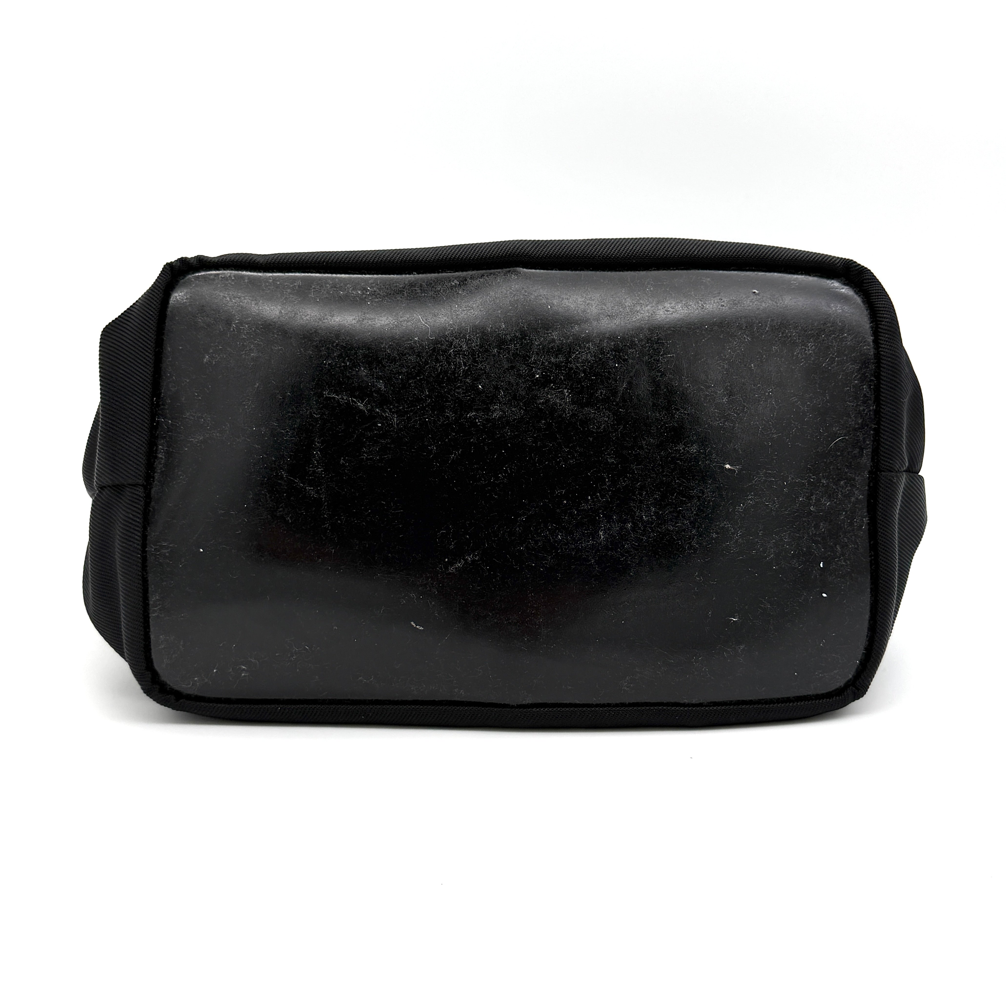 Gucci black nylon shoulder bag with bamboo handle and leather trim, photographed against a white background.