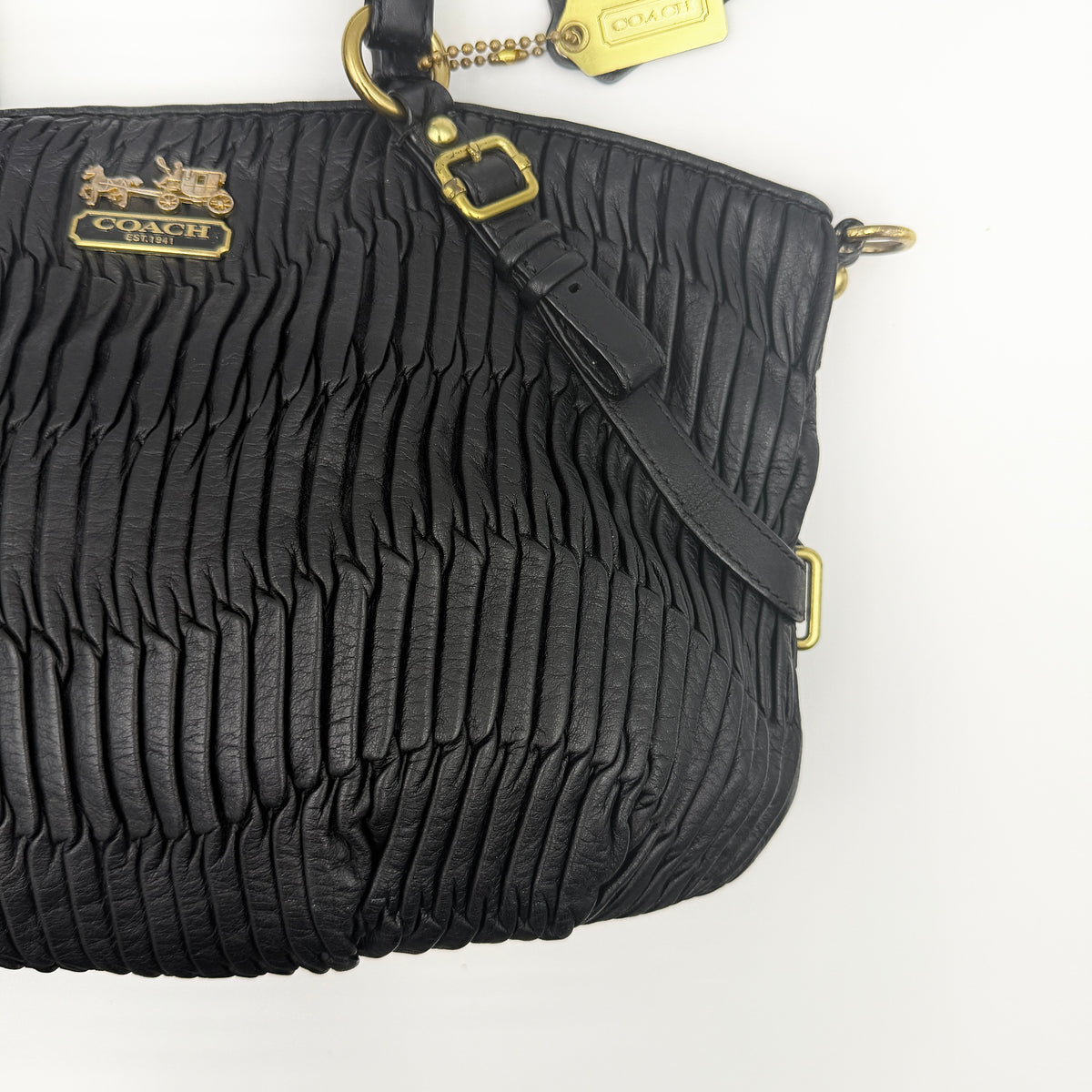 Coach Sophia Madison Pleated Shoulder Bag in black leather with gold hardware, displayed with detachable strap and dust bag.