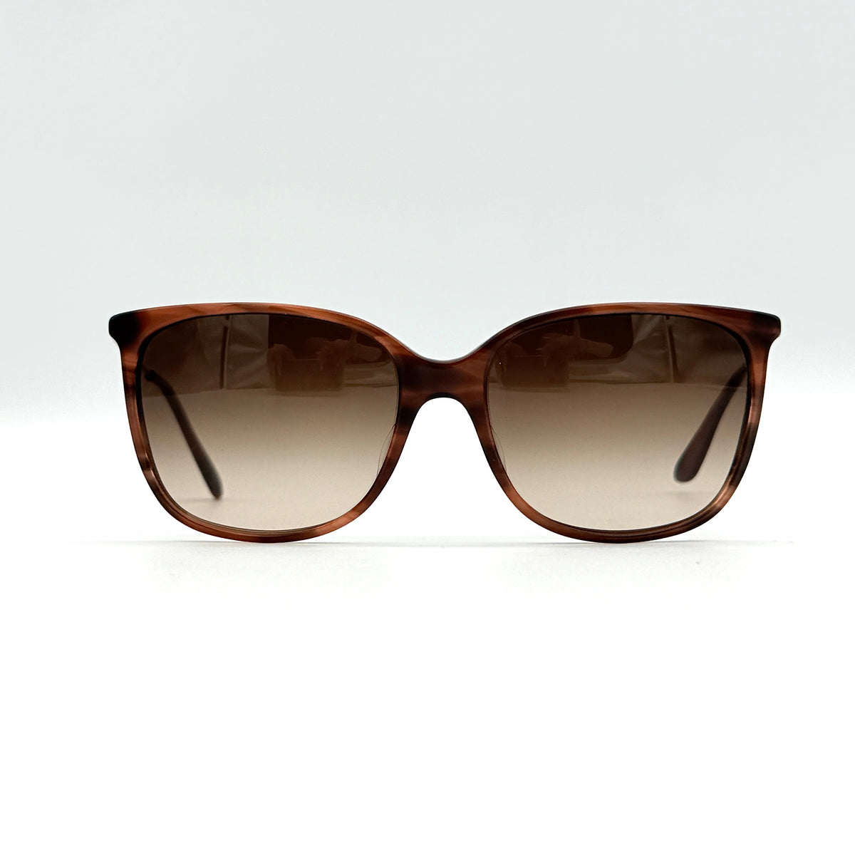 Giorgio Armani AR 8080-F sunglasses in brown tortoise with gradient brown lenses and slim gold-tone arms, displayed at an angle.