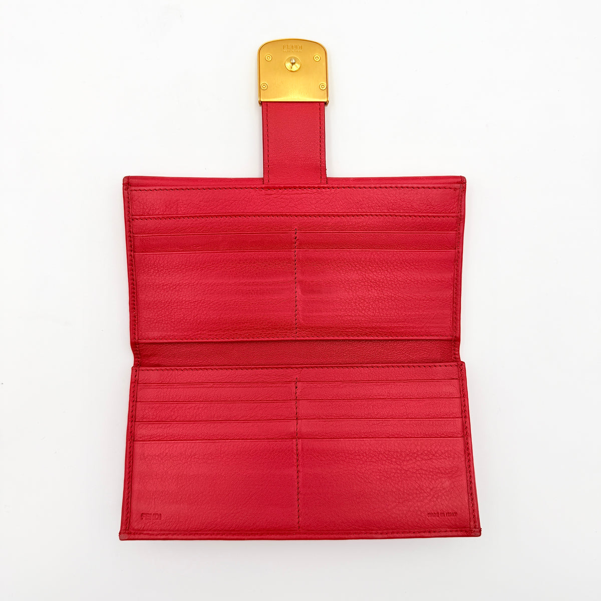 Fendi FF Logo Buckle Flap Continental Wallet in red leather with gold hardware, displayed closed on a white background.