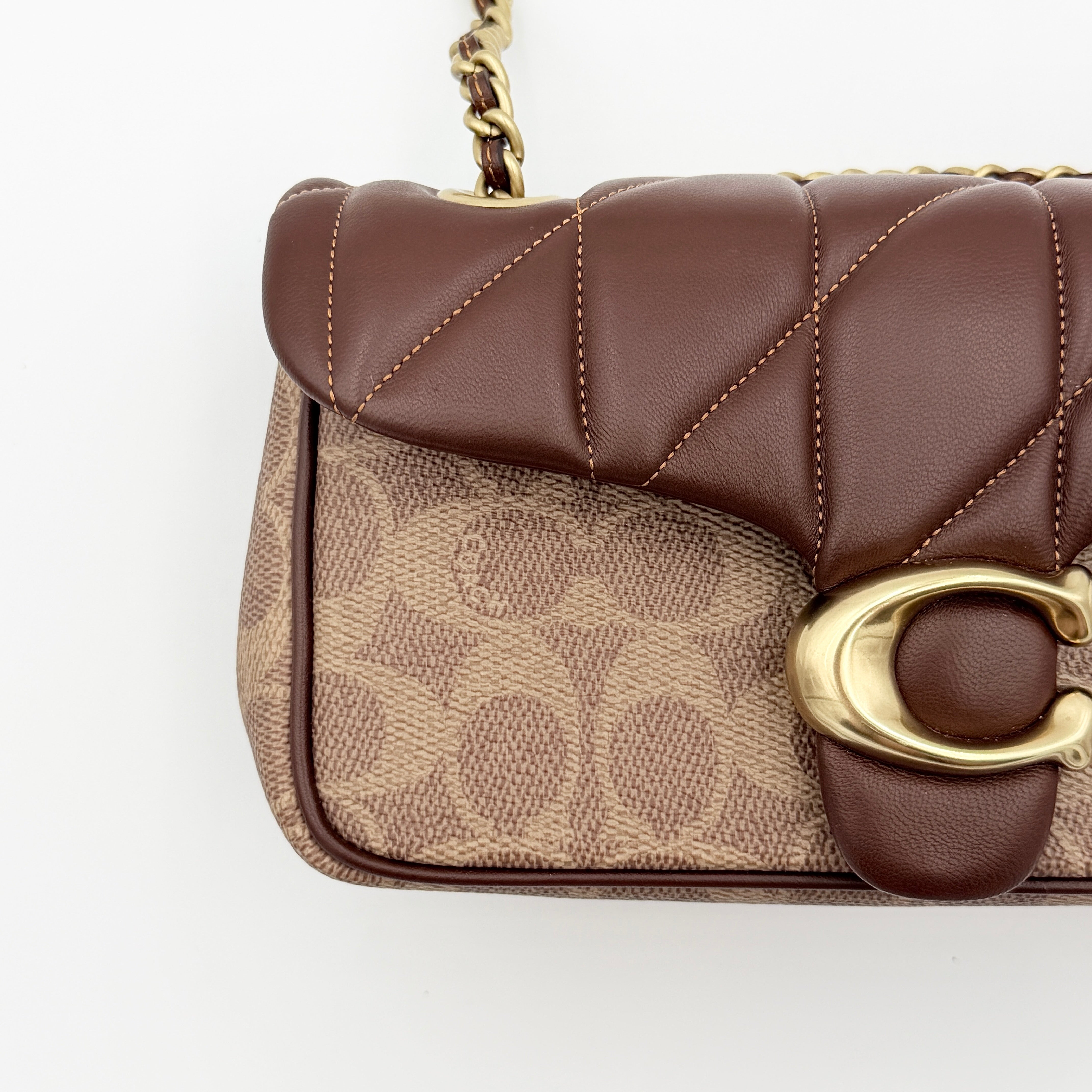 Coach Signature Quilted Tabby Shoulder Bag in brown monogram canvas with gold chain strap and oversized C clasp.