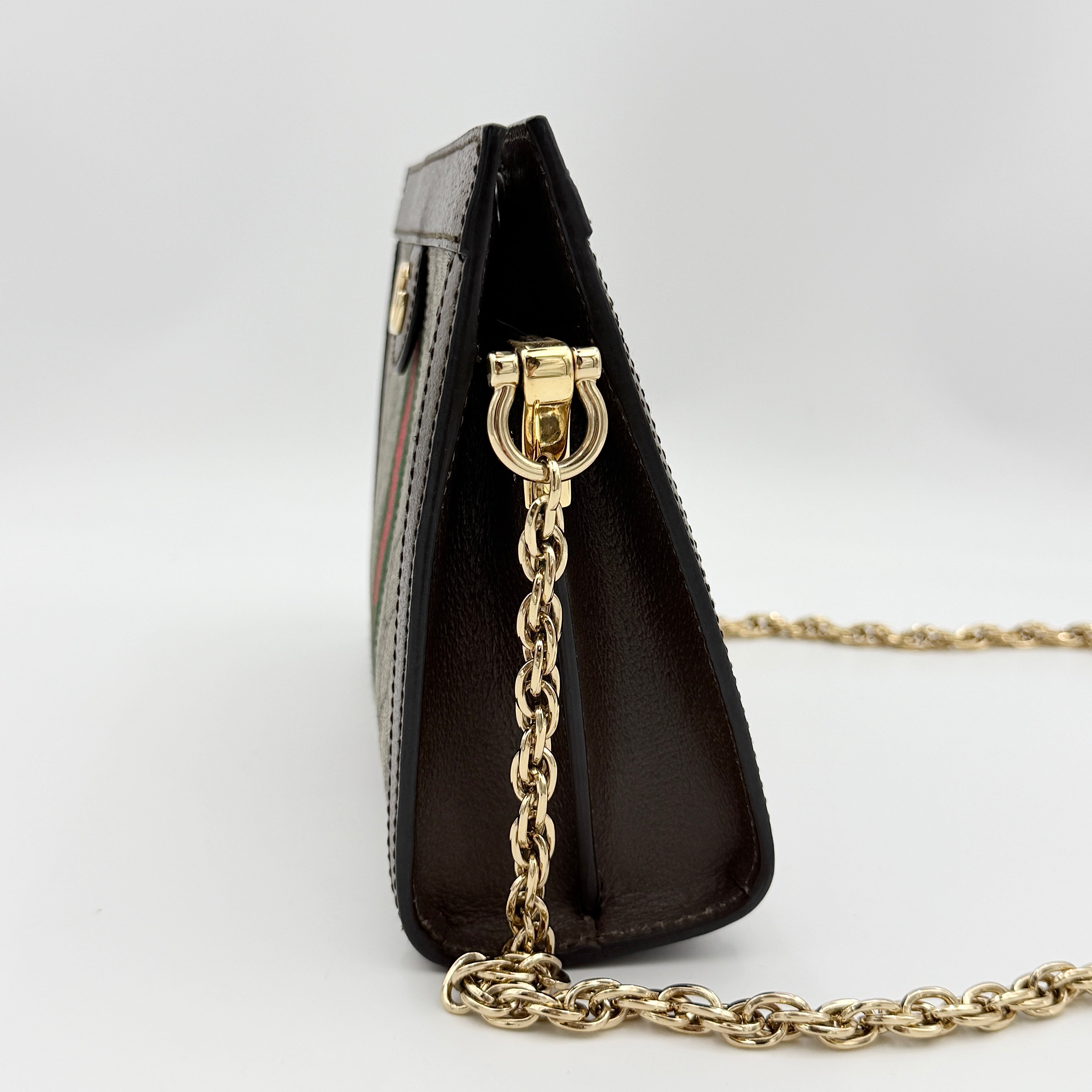 Gucci Ophidia GG Supreme crossbody bag in beige canvas with brown leather trim, signature web stripe, and gold chain strap.