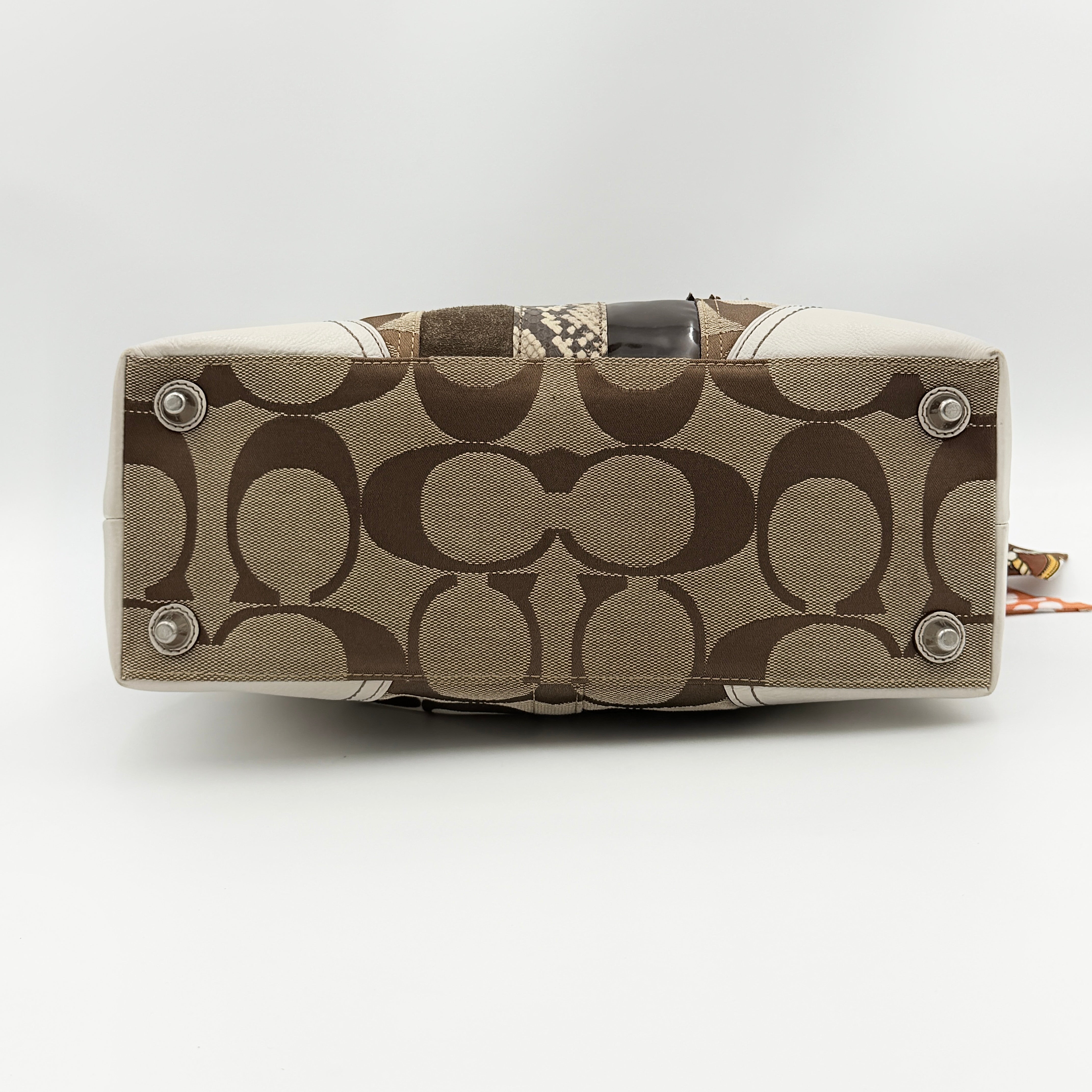 Coach Signature Hampton Python Stripe Handbag in multicolour leather and canvas with silver-tone hardware and an orange scarf detail.