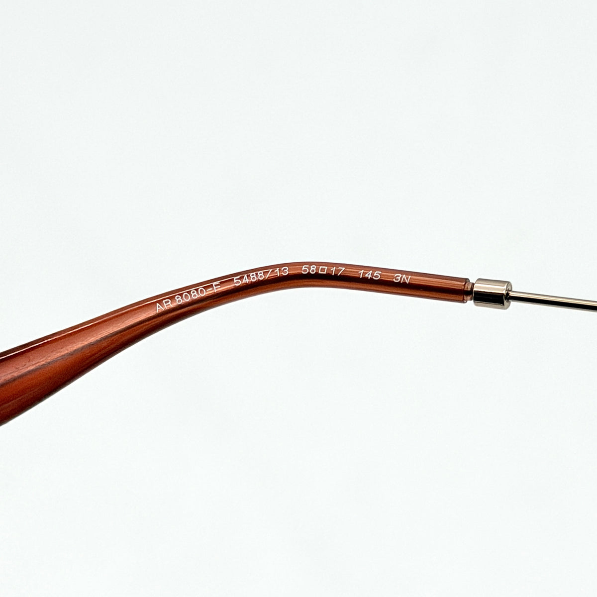 Giorgio Armani AR 8080-F sunglasses in brown tortoise with gradient brown lenses and slim gold-tone arms, displayed at an angle.