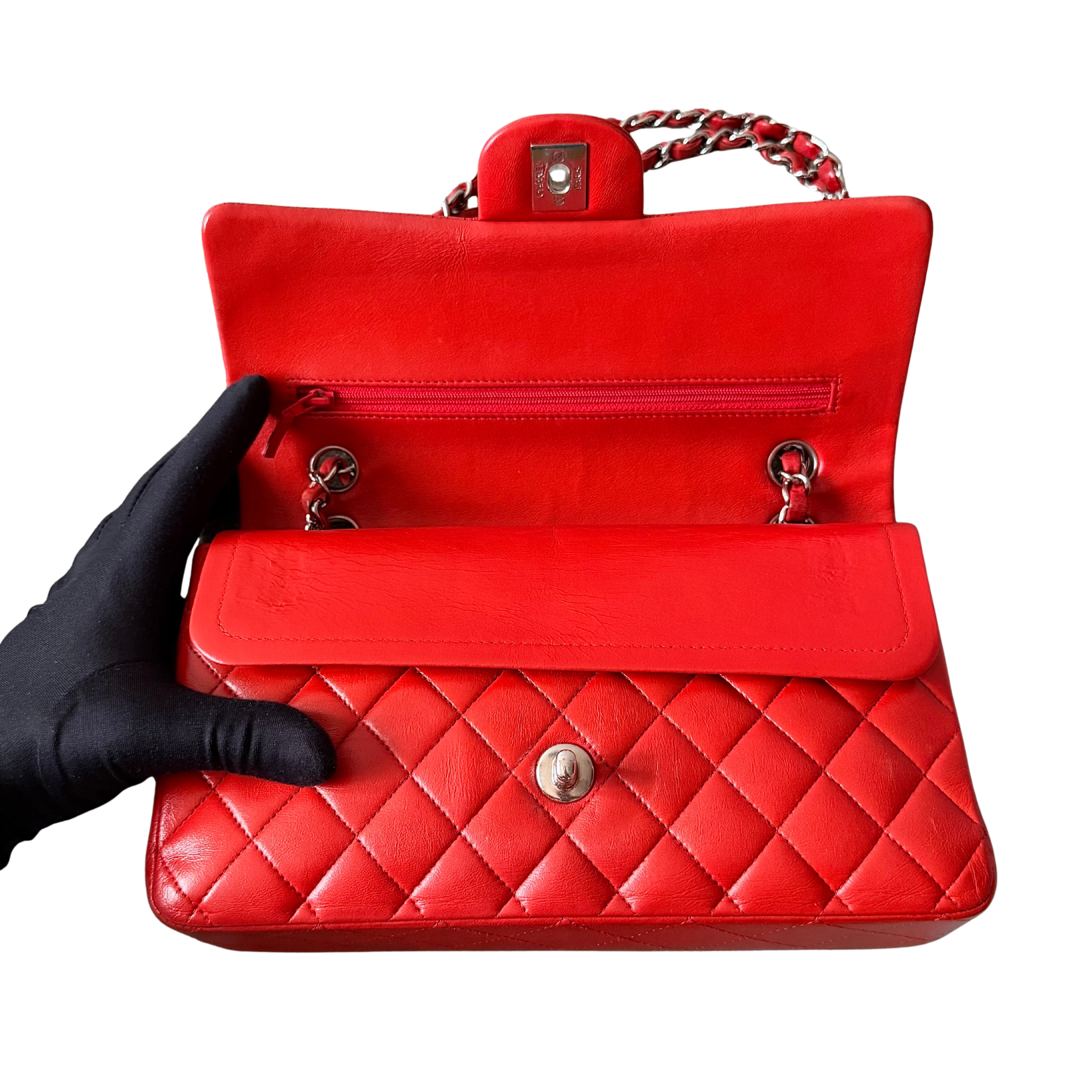 Chanel double flap shoulder bag in quilted red leather with silver-tone hardware and chain leather strap.