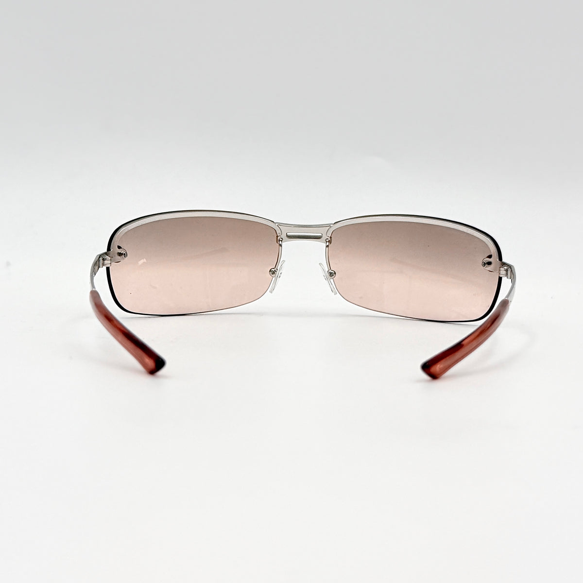 Dior Adiorable 3/L rimless sunglasses with rose pink gradient lenses and silver frame, presented with Dior hard case.
