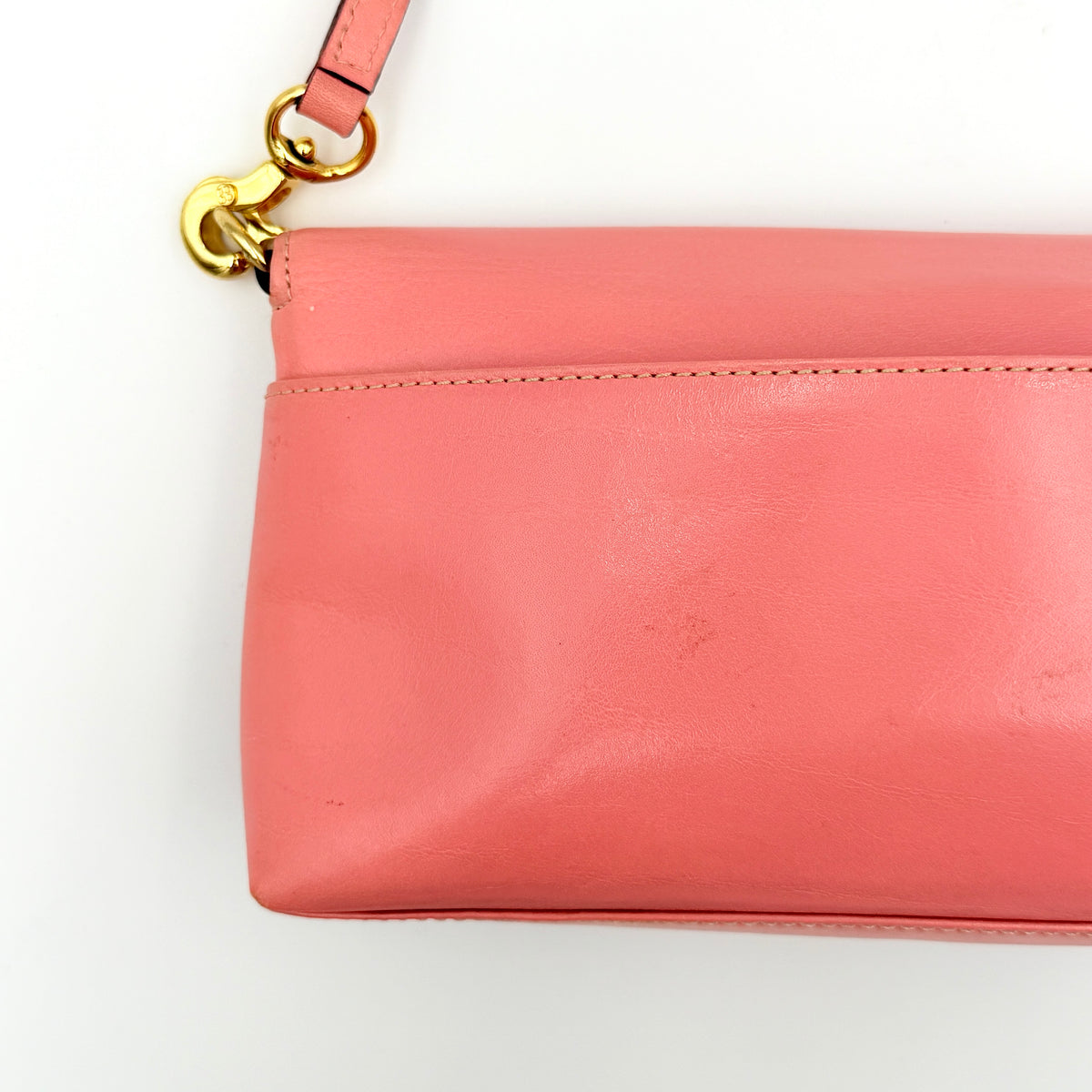 Kate Spade Morgan East West Shoulder Bag in smooth pink leather with gold-tone hardware and a green interior, displayed on white background.