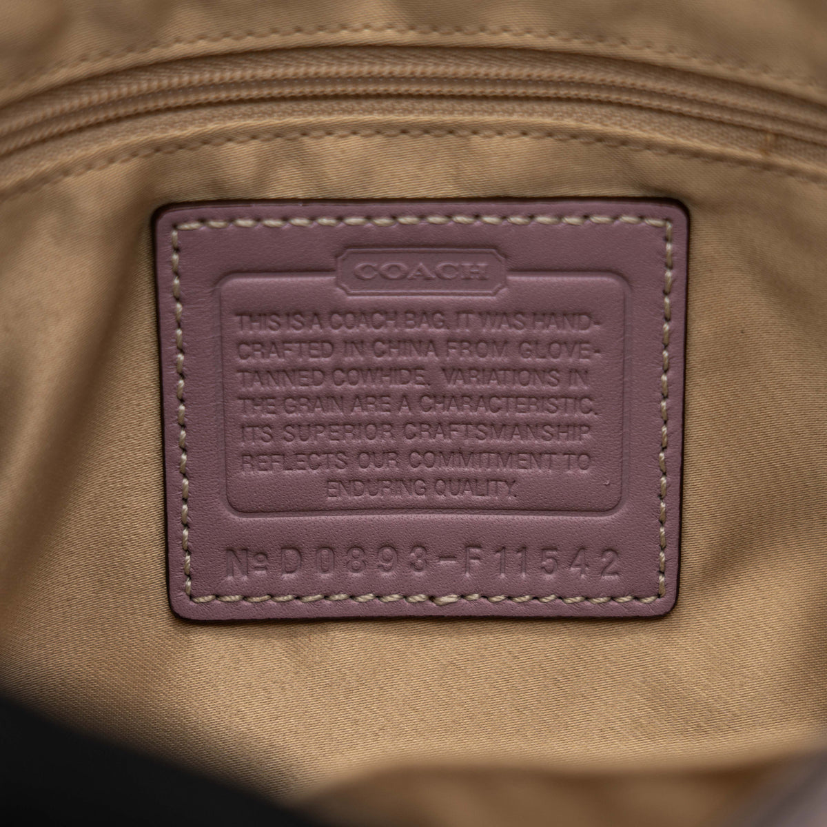 Coach Hamptons Turnlock Shoulder Bag in lilac purple leather with gold-tone hardware and contrast stitching, shown from the front.