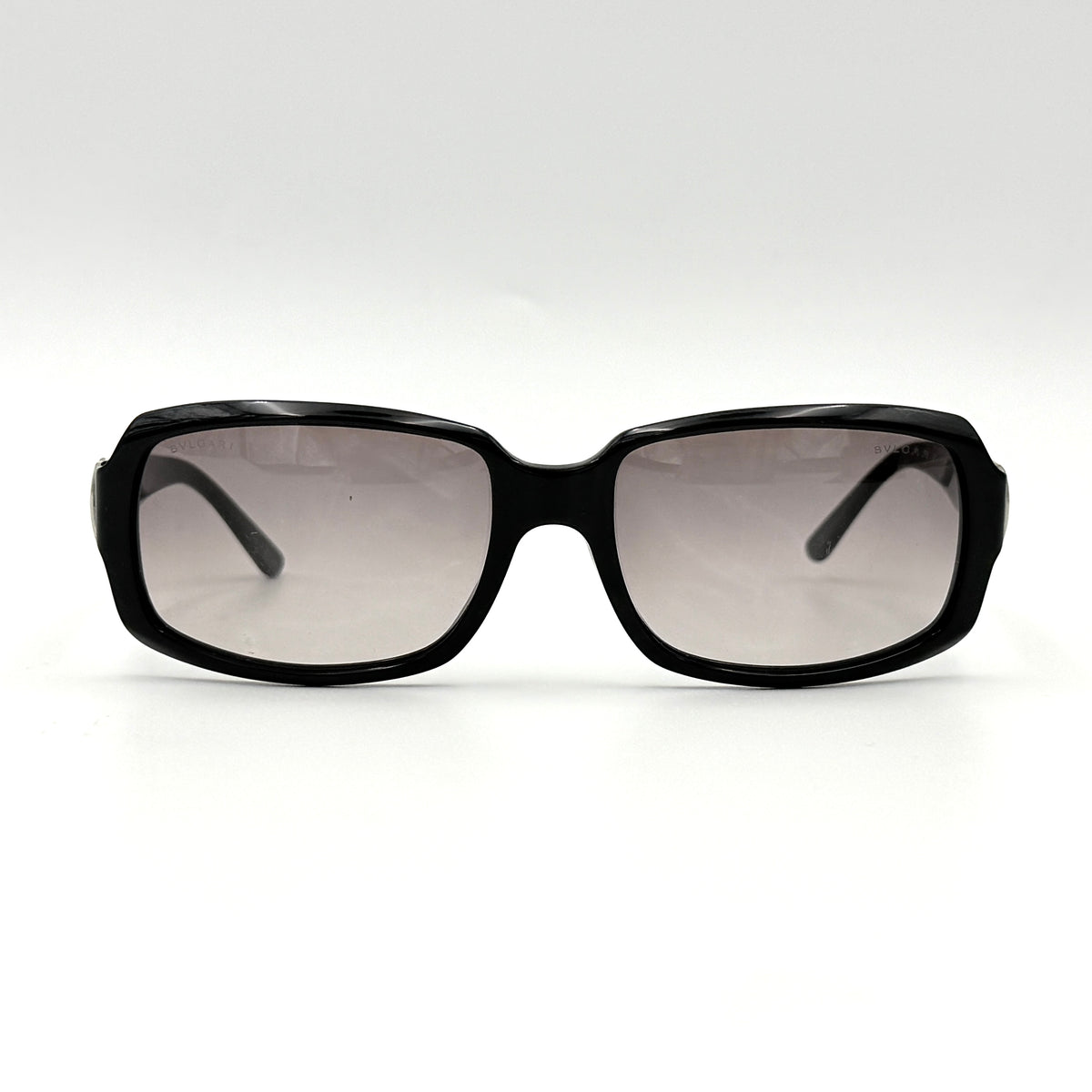 Bvlgari 829 501/11 black sunglasses with silver and gold temple hardware, displayed with case and cleaning cloth.