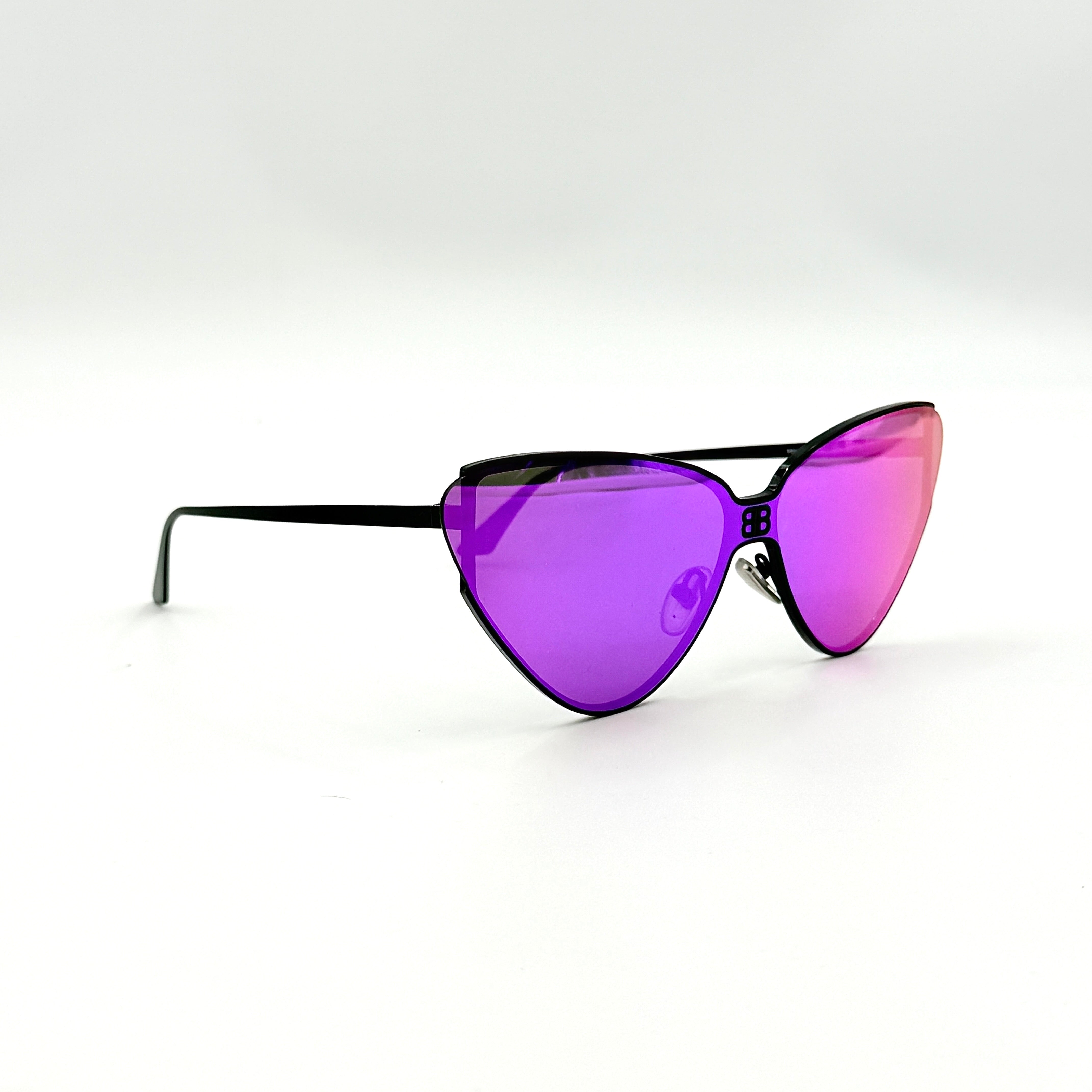 Balenciaga cat-eye sunglasses with purple mirrored lenses and black frame, featuring signature BB logo at the bridge.