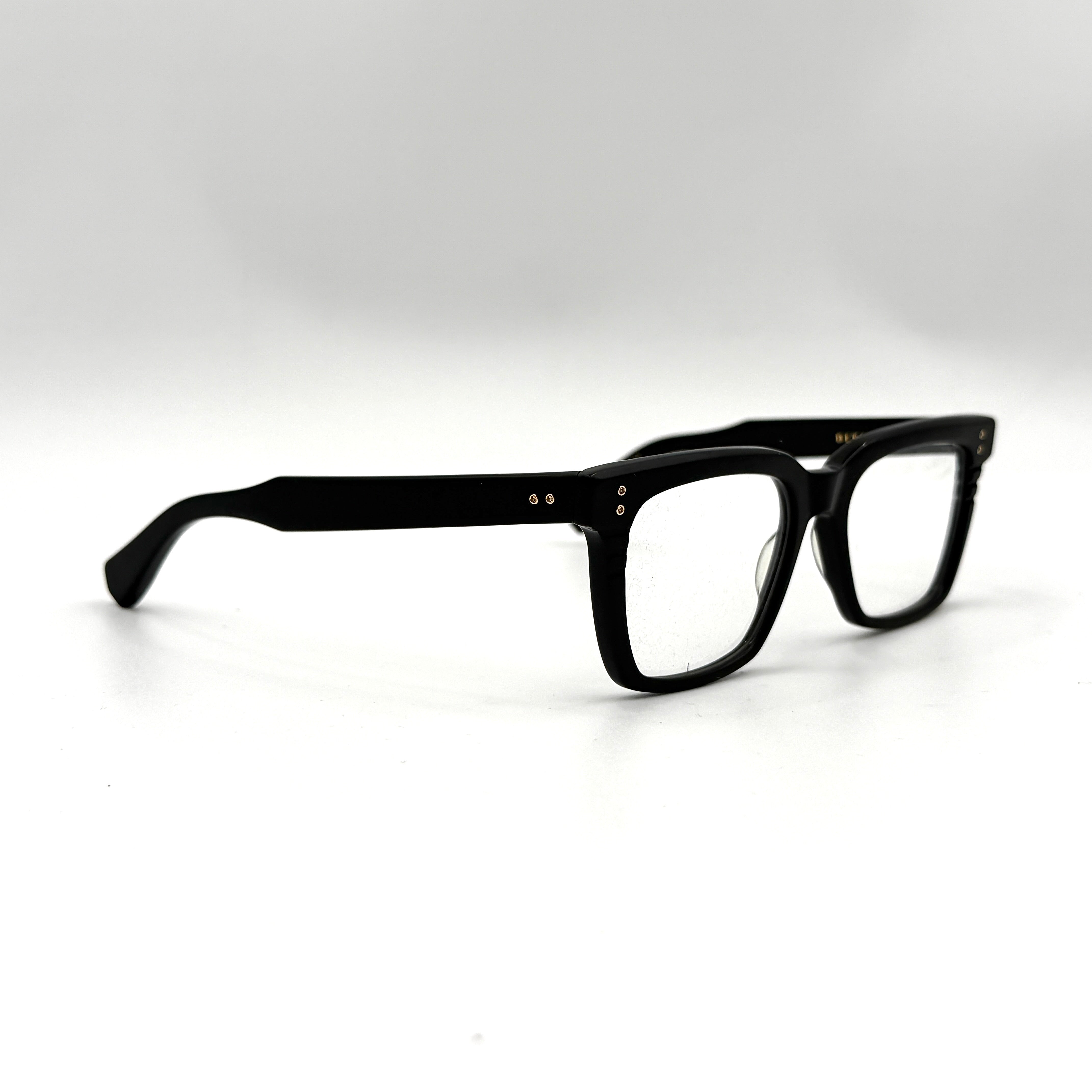DITA Sequoia DRX-2086 black square-frame sunglasses with gold-tone accents and branded case.