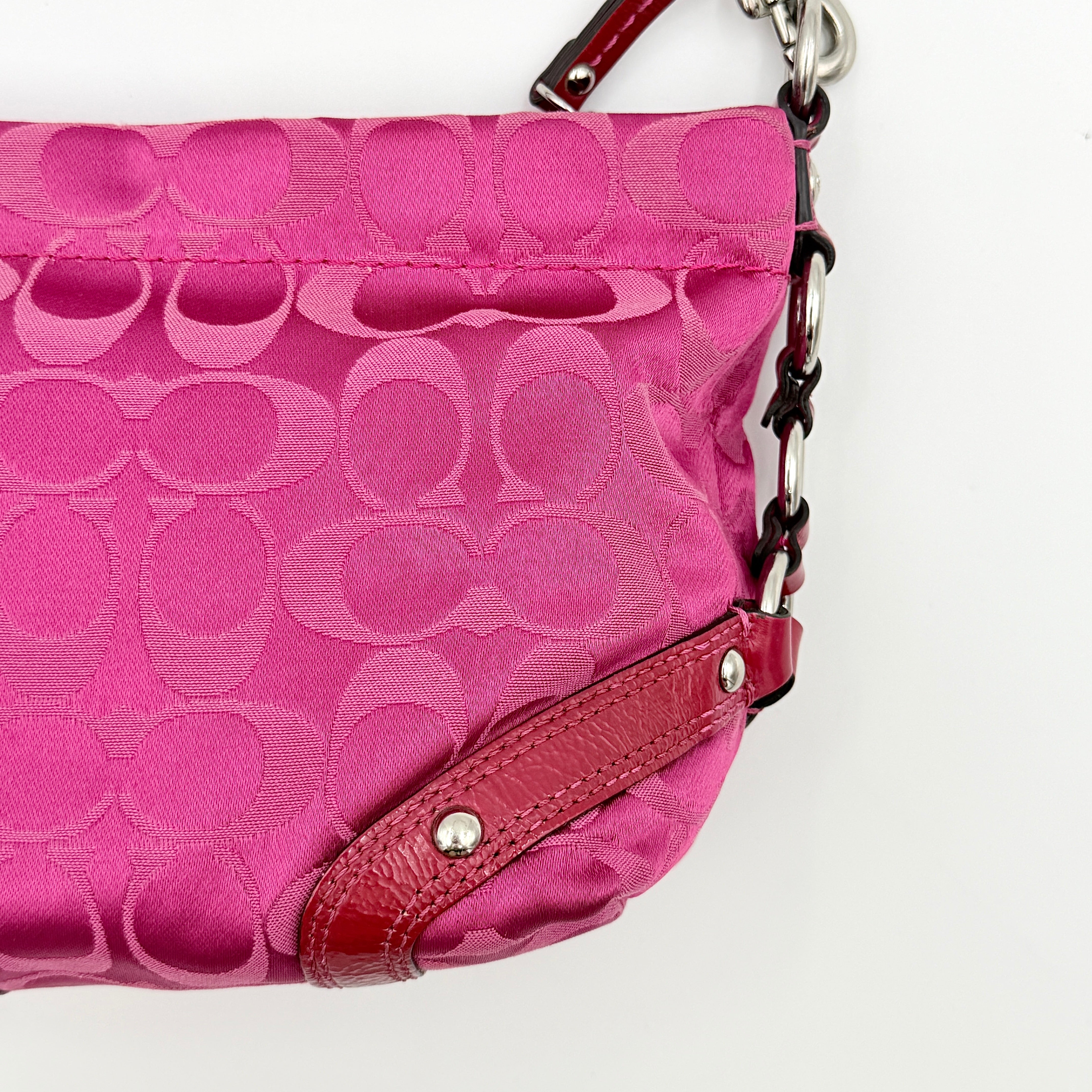 Coach Carly Hobo Shoulder Bag in vivid pink jacquard and leather, featuring signature chain detail and silver hardware.