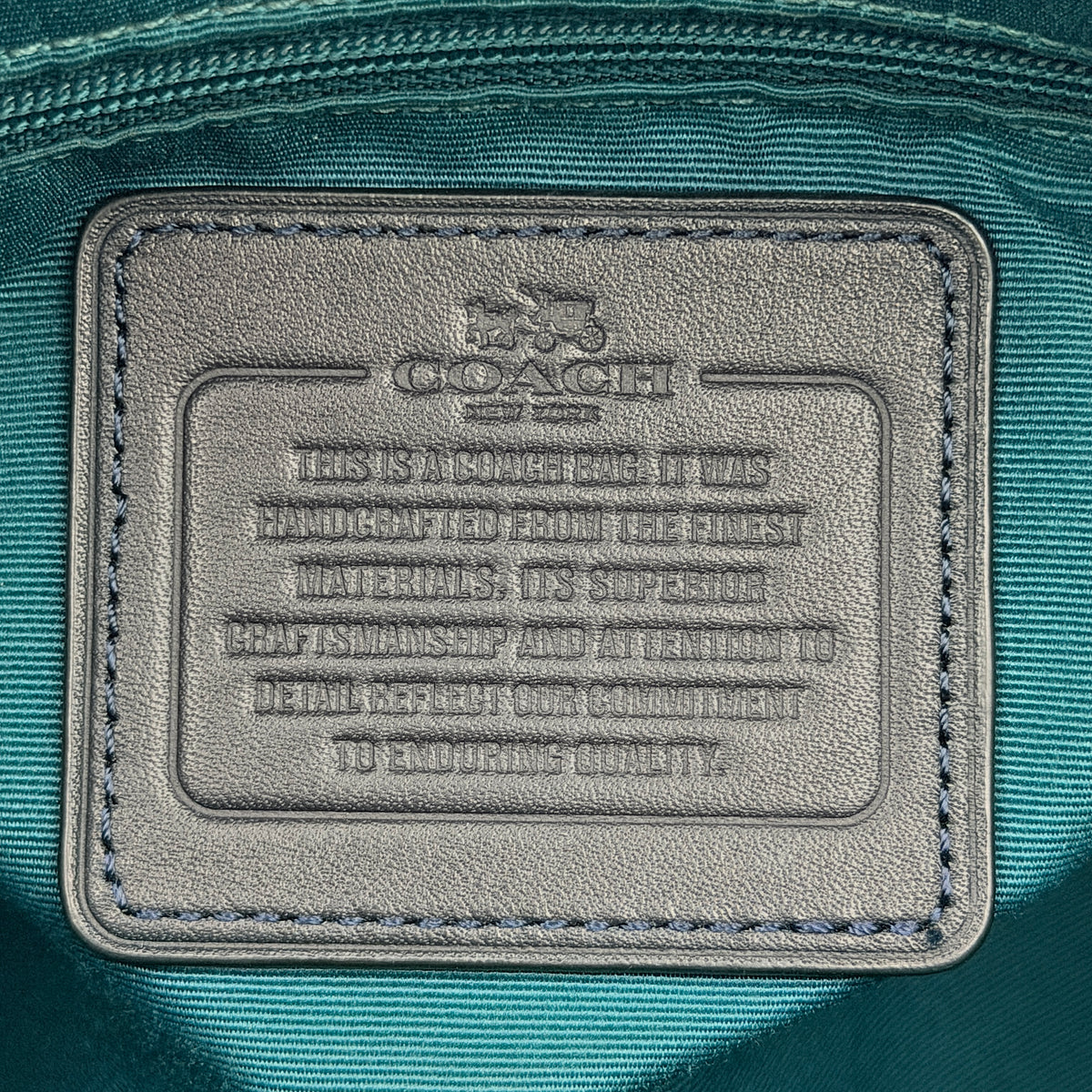 Coach Signature Mini Bennett Boston Bag in monogram canvas with navy and teal varsity stripes and dark navy leather trim.