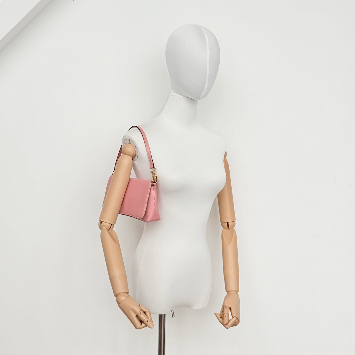 Kate Spade Morgan East West Shoulder Bag in smooth pink leather with gold-tone hardware and a green interior, displayed on white background.