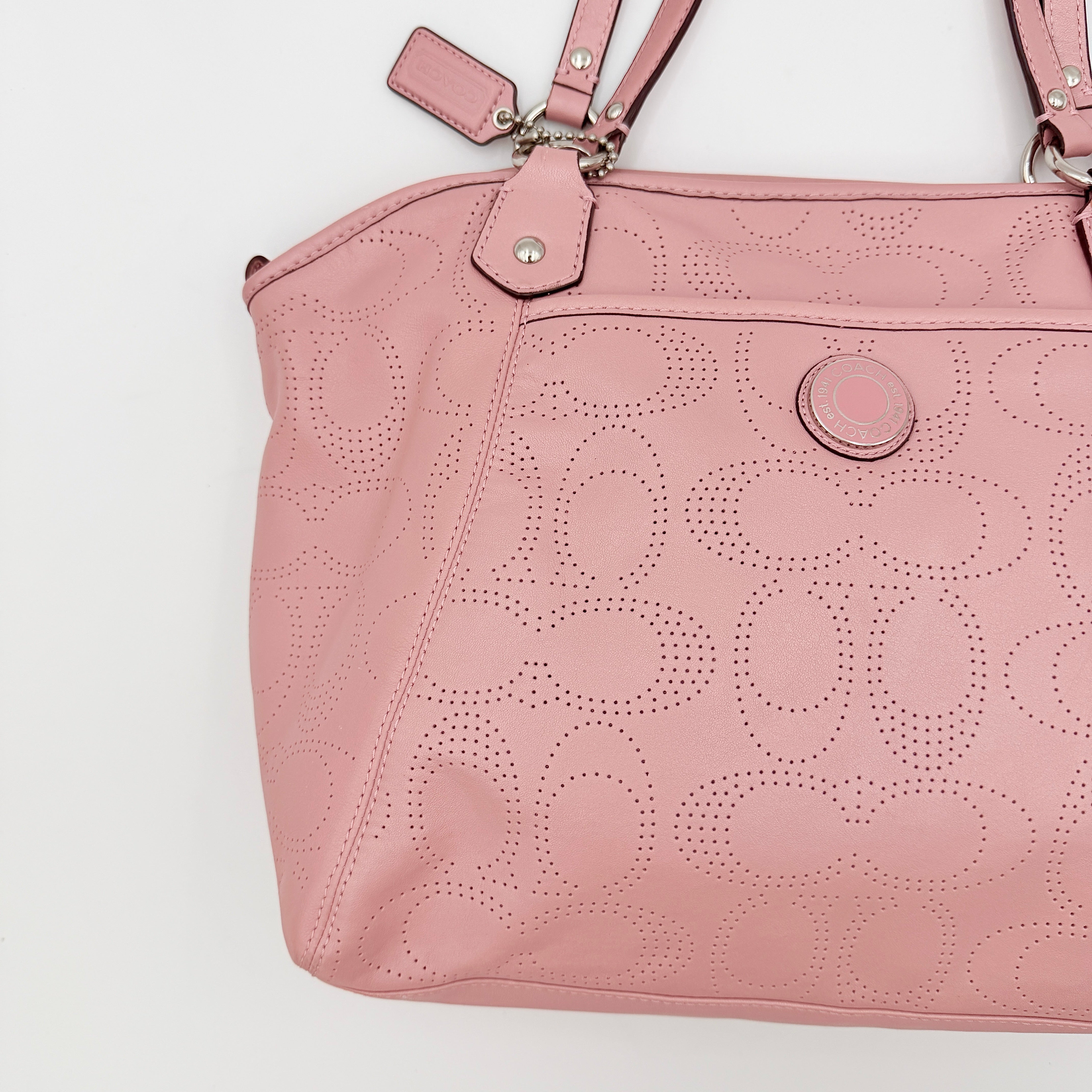 Coach 2Way Perforated Shoulder Bag in soft pink leather with silver hardware and detachable strap, displayed on a white background.