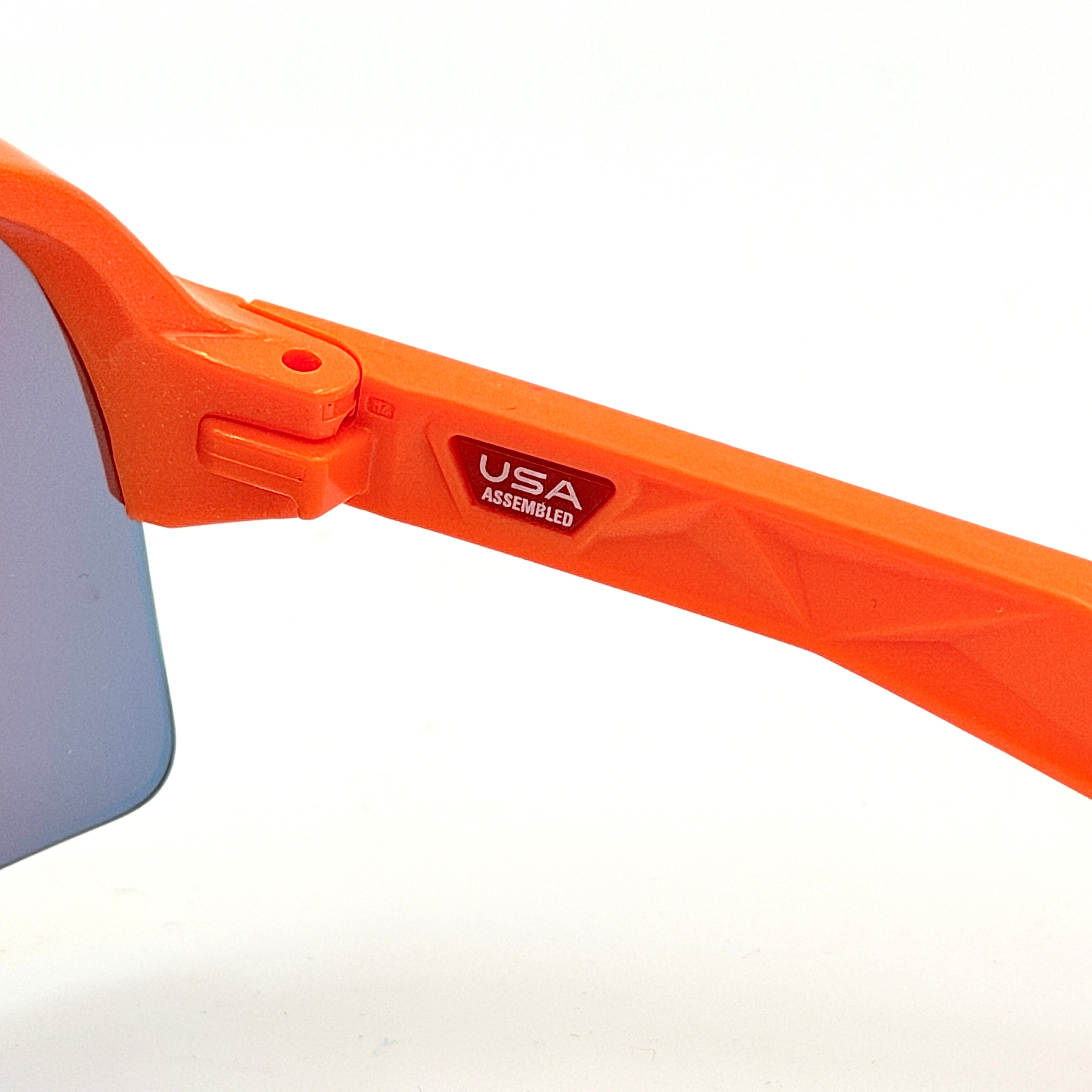 Oakley Sutro Lite Sweep MVDP Prizm Road sunglasses in orange sparkle with a shield lens and original pouch, photographed in bright studio lighting.