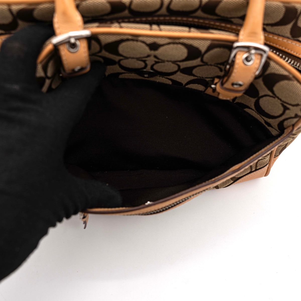 Coach Signature Hampton Satchel Boston Bag in beige and tan canvas with leather trim and silver hardware, styled on a clean background.