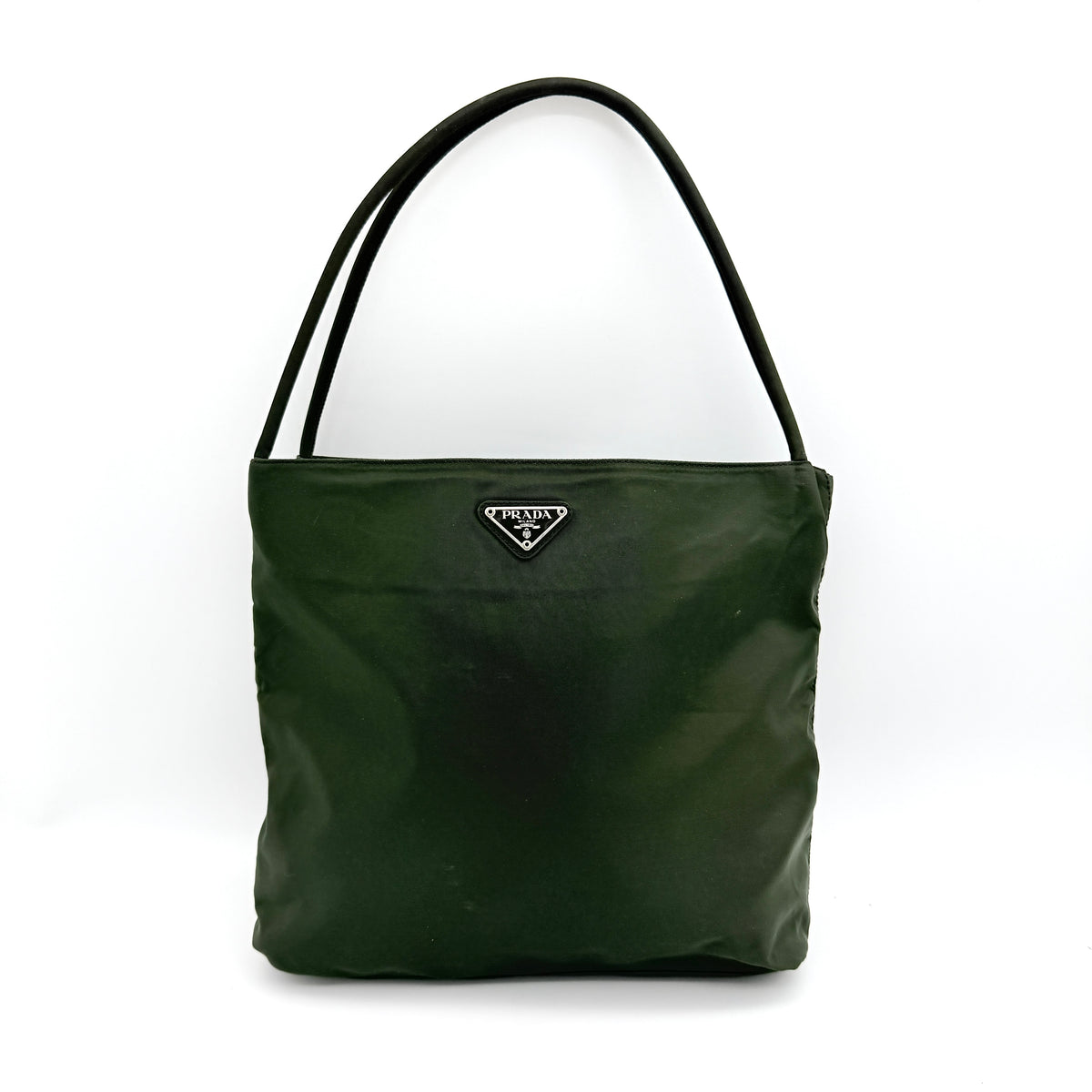 Prada Tessuto Nylon City Tote Bag in dark green nylon with double handles and signature triangle logo plaque on the front.