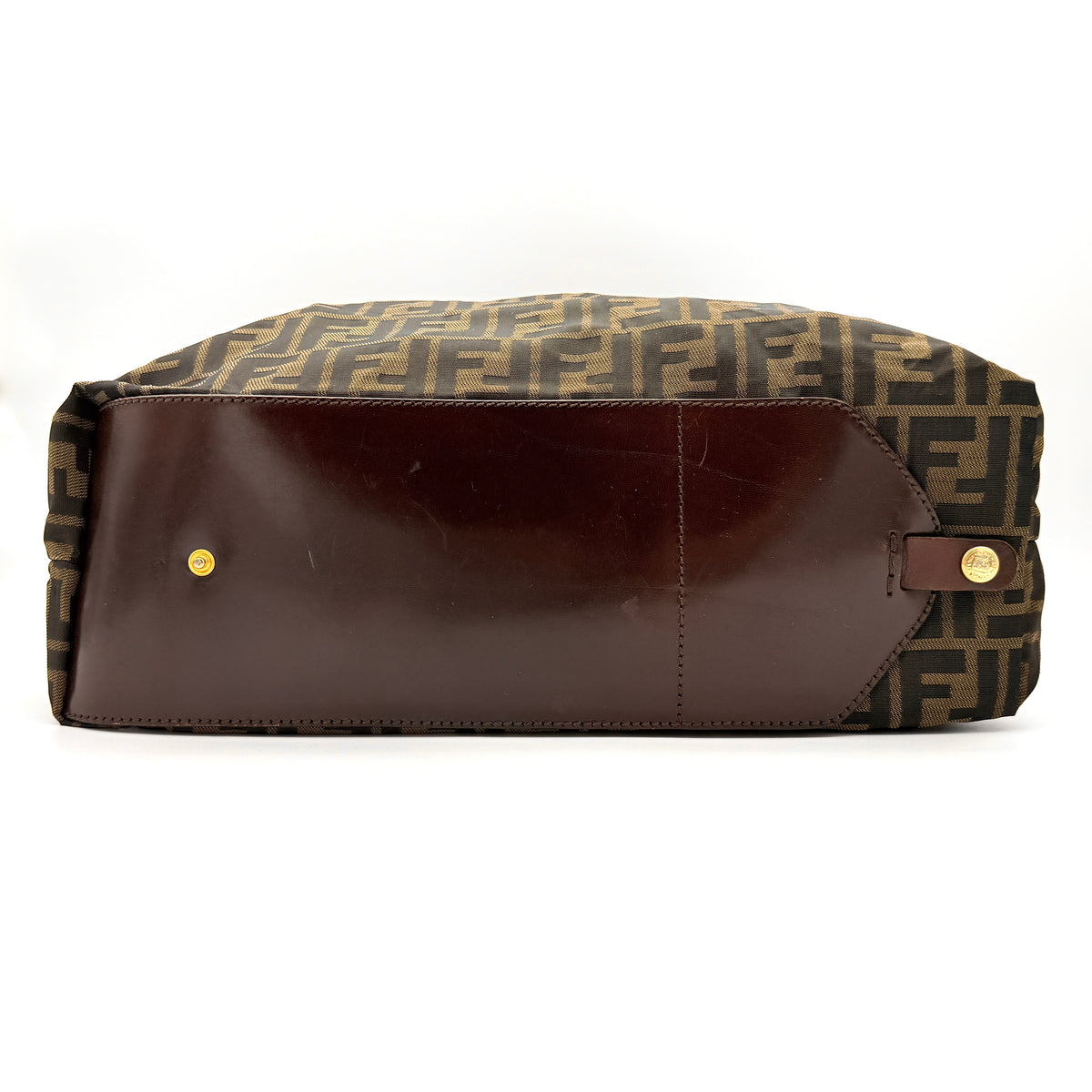 Fendi FF Zucca foldable tote bag in brown canvas with leather top handles and all-over monogram, shown standing upright.