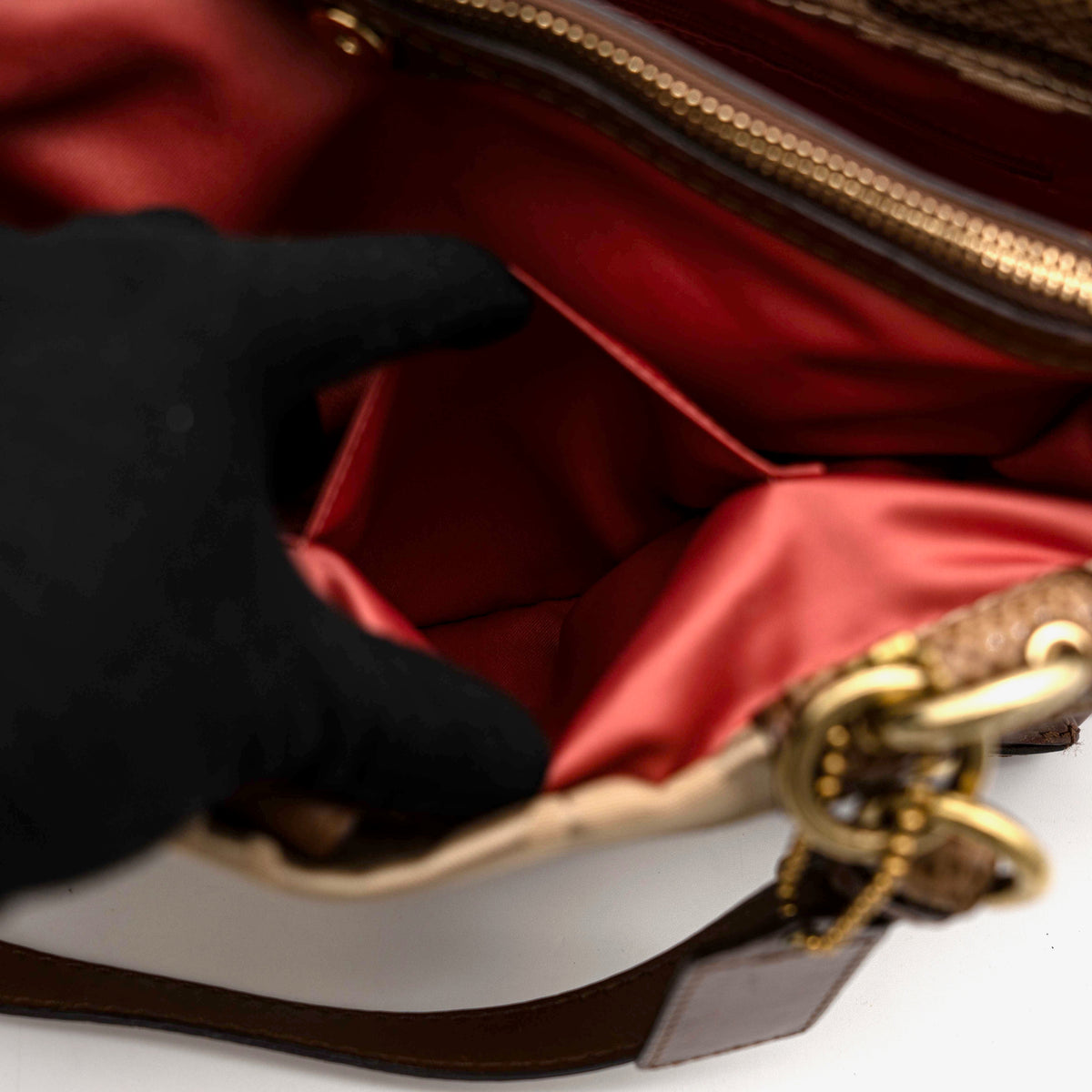 Coach Signature Peyton Shoulder Bag in brown sateen and leather with gold-tone hardware and turnlock pocket, photographed on a white background.