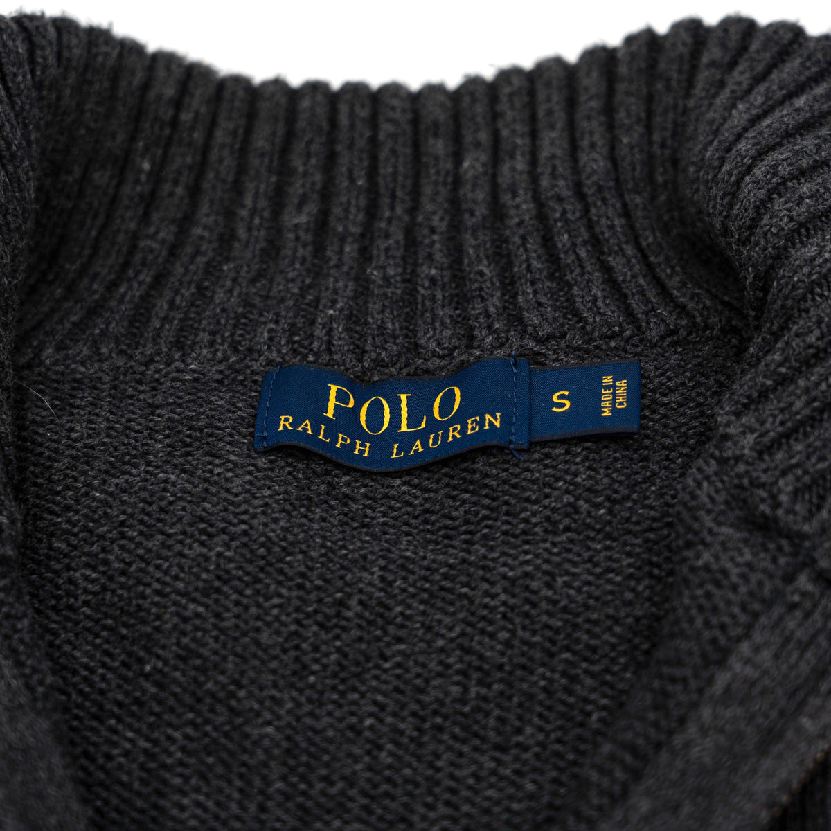 Dark grey Polo Ralph Lauren quarter zip mockneck pullover sweater with ribbed collar and green pony logo.