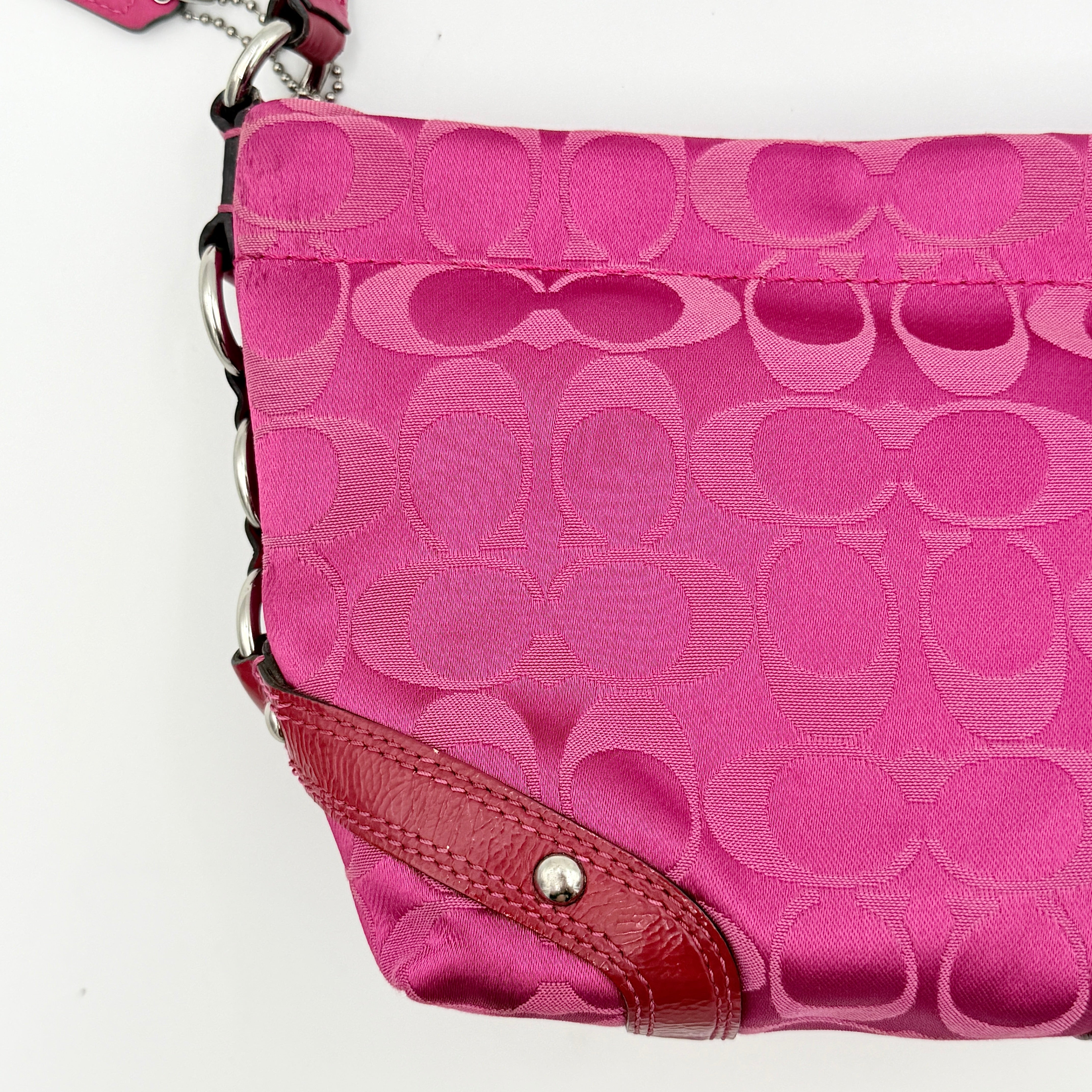 Coach Carly Hobo Shoulder Bag in vivid pink jacquard and leather, featuring signature chain detail and silver hardware.