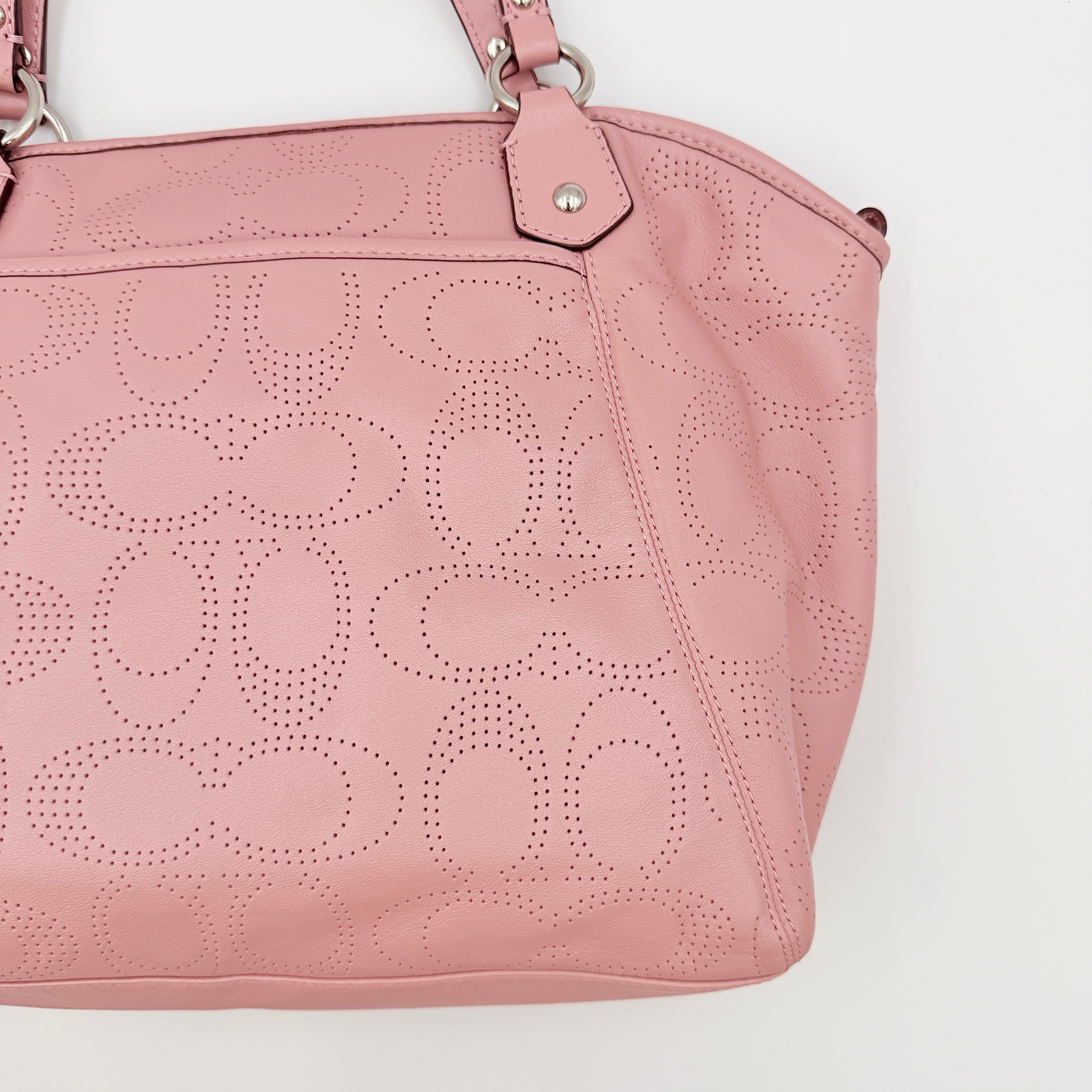 Coach 2Way Perforated Shoulder Bag in soft pink leather with silver hardware and detachable strap, displayed on a white background.