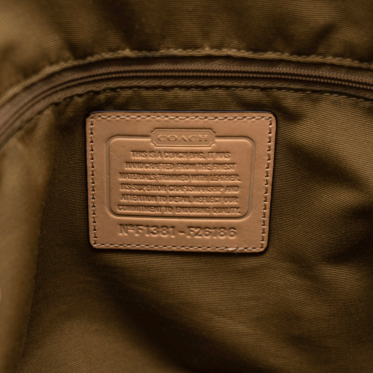 Coach Signature Peyton Pocket tote bag in brown canvas with tan leather trim, shown with both handles and detachable strap.