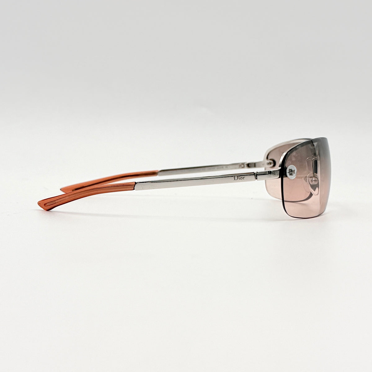 Dior Adiorable 3/L rimless sunglasses with rose pink gradient lenses and silver frame, presented with Dior hard case.