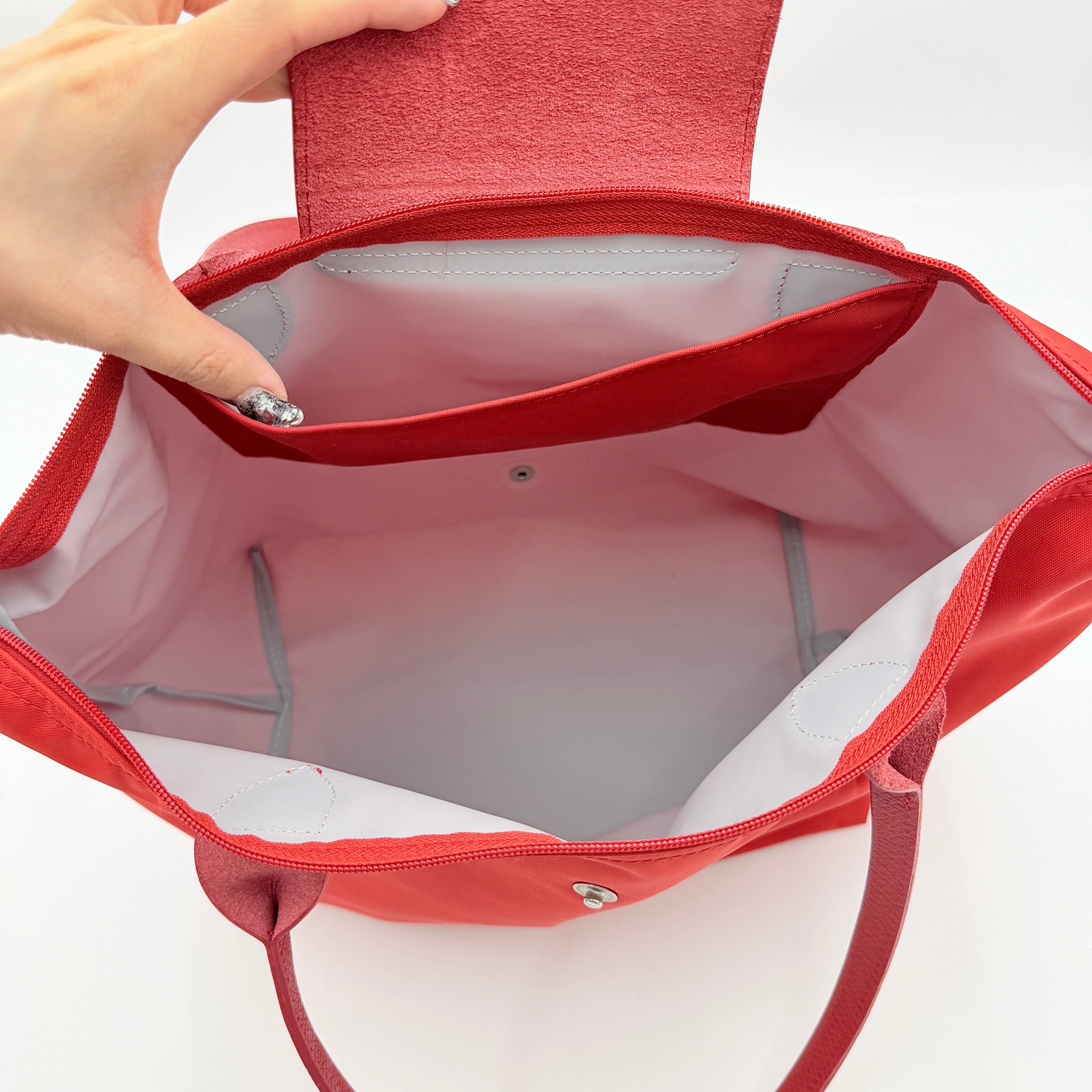 Longchamp Le Pliage Club tote bag in red nylon with tonal leather accents and silver hardware.