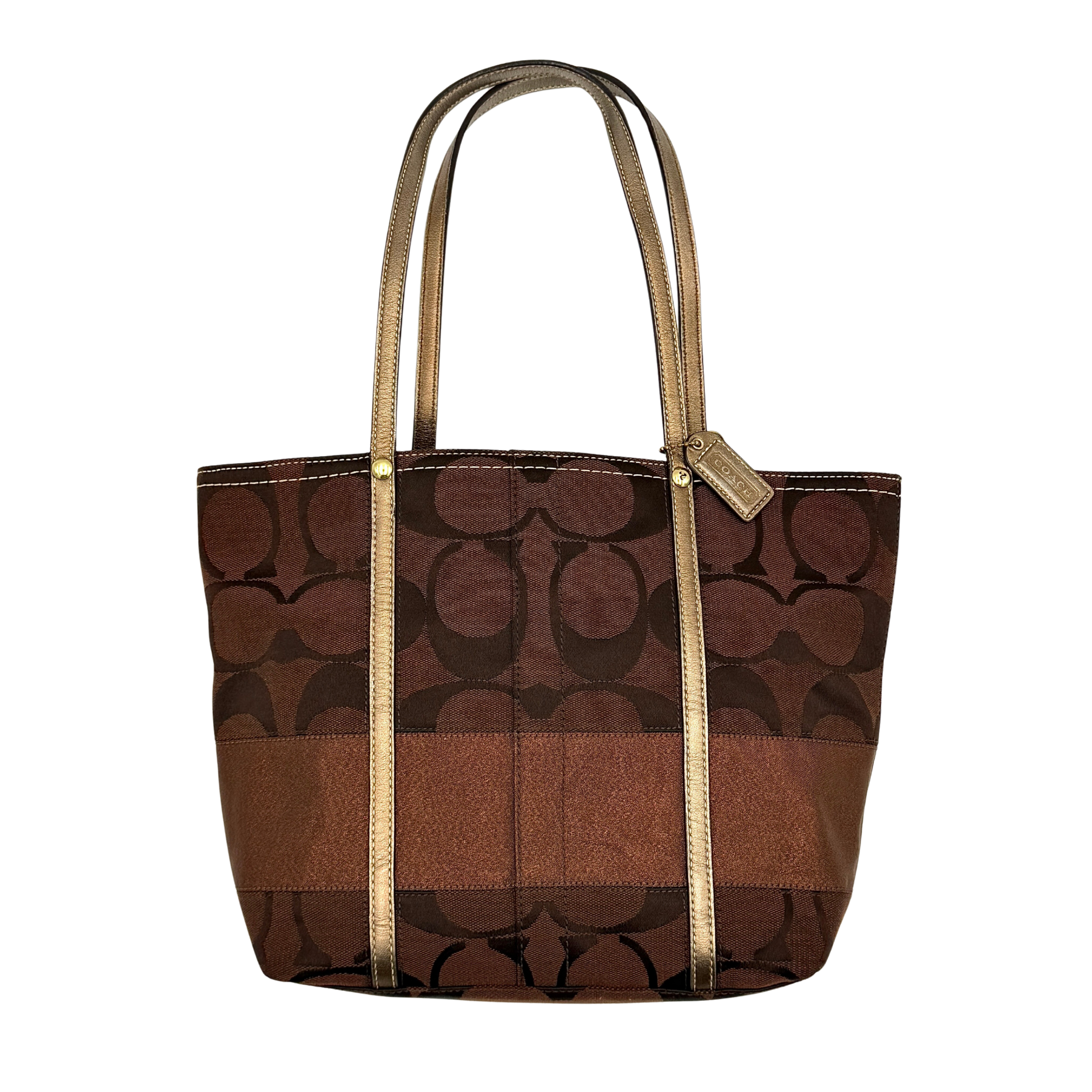 Coach Signature Stripe Tote Bag in rich brown monogram canvas with metallic gold leather handles, photographed upright against a clean background.