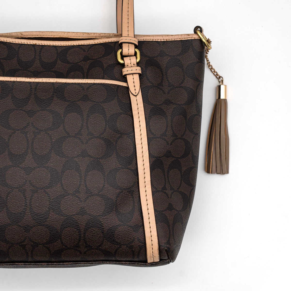 Coach Signature Peyton Pocket tote bag in brown canvas with tan leather trim, shown with both handles and detachable strap.