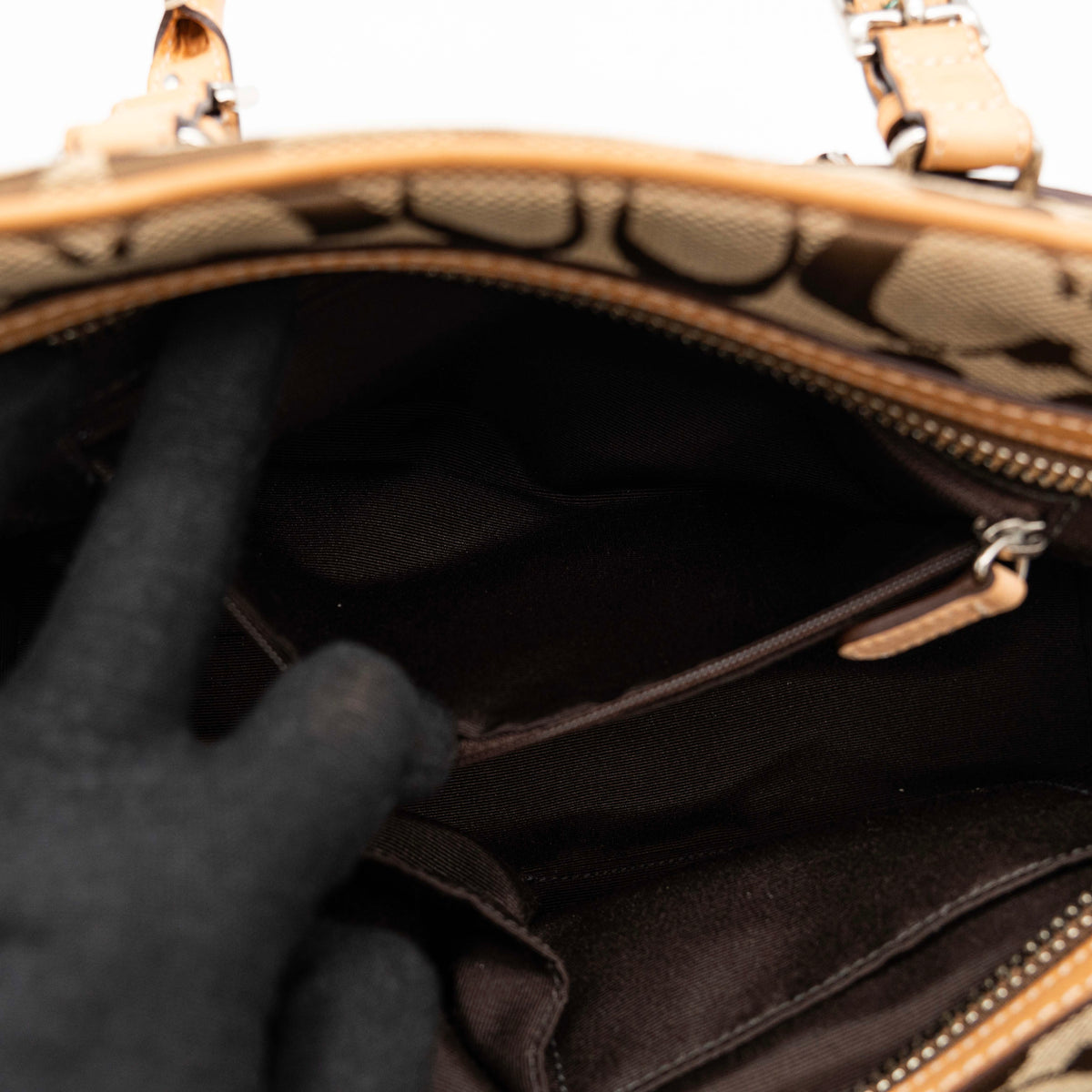 Coach Signature Hampton Satchel Boston Bag in beige and tan canvas with leather trim and silver hardware, styled on a clean background.