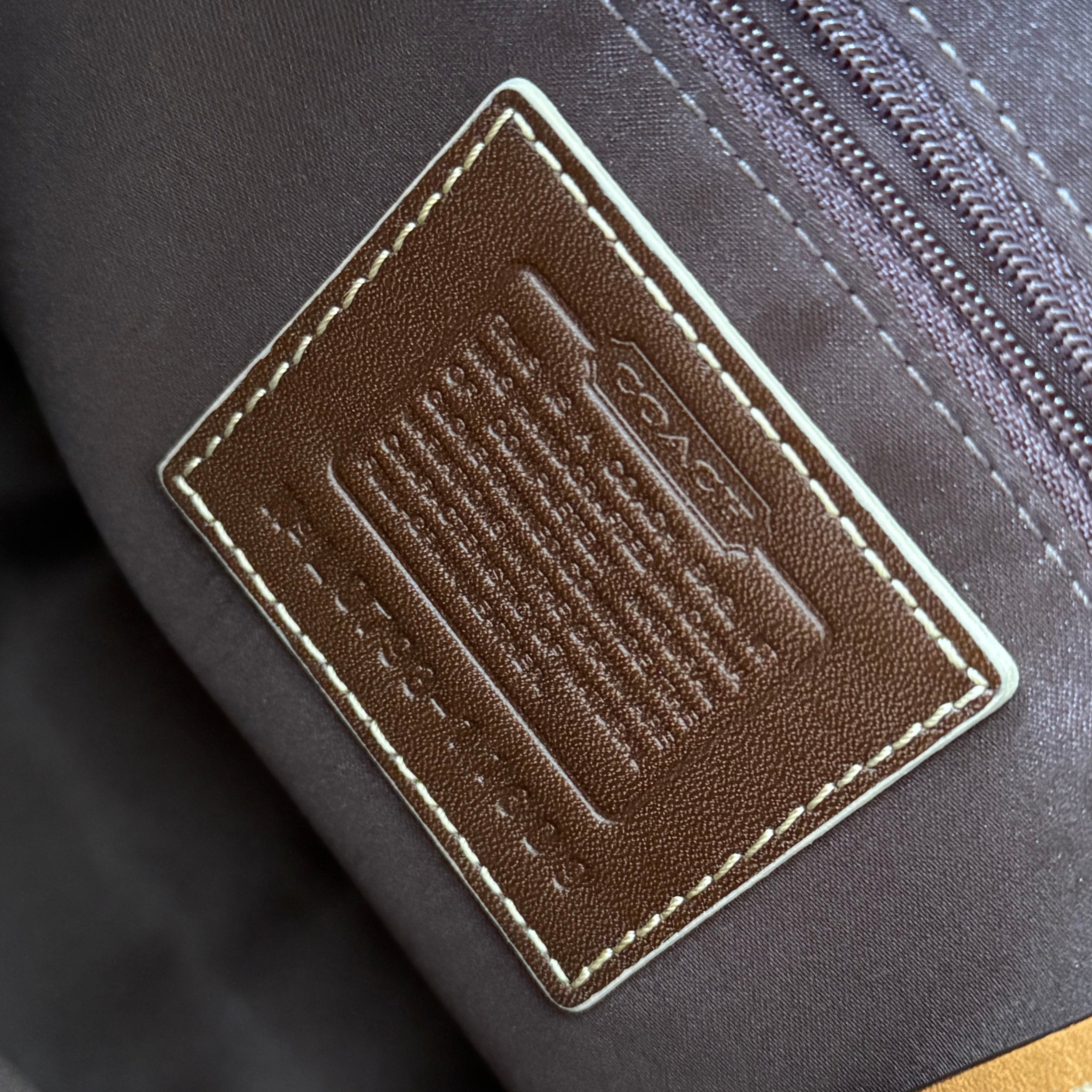 Coach Hampton Vintage Brown Beige Tan Handbag, crafted in leather with embossed signature panel, patent leather stripes, gold-tone hardware, and dual shoulder straps.