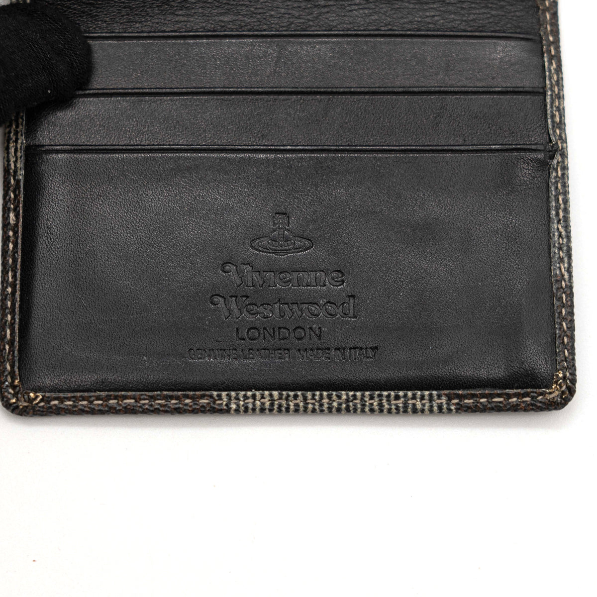 Vivienne Westwood black and grey stripe cardholder with gold Orb plaque against a white background.