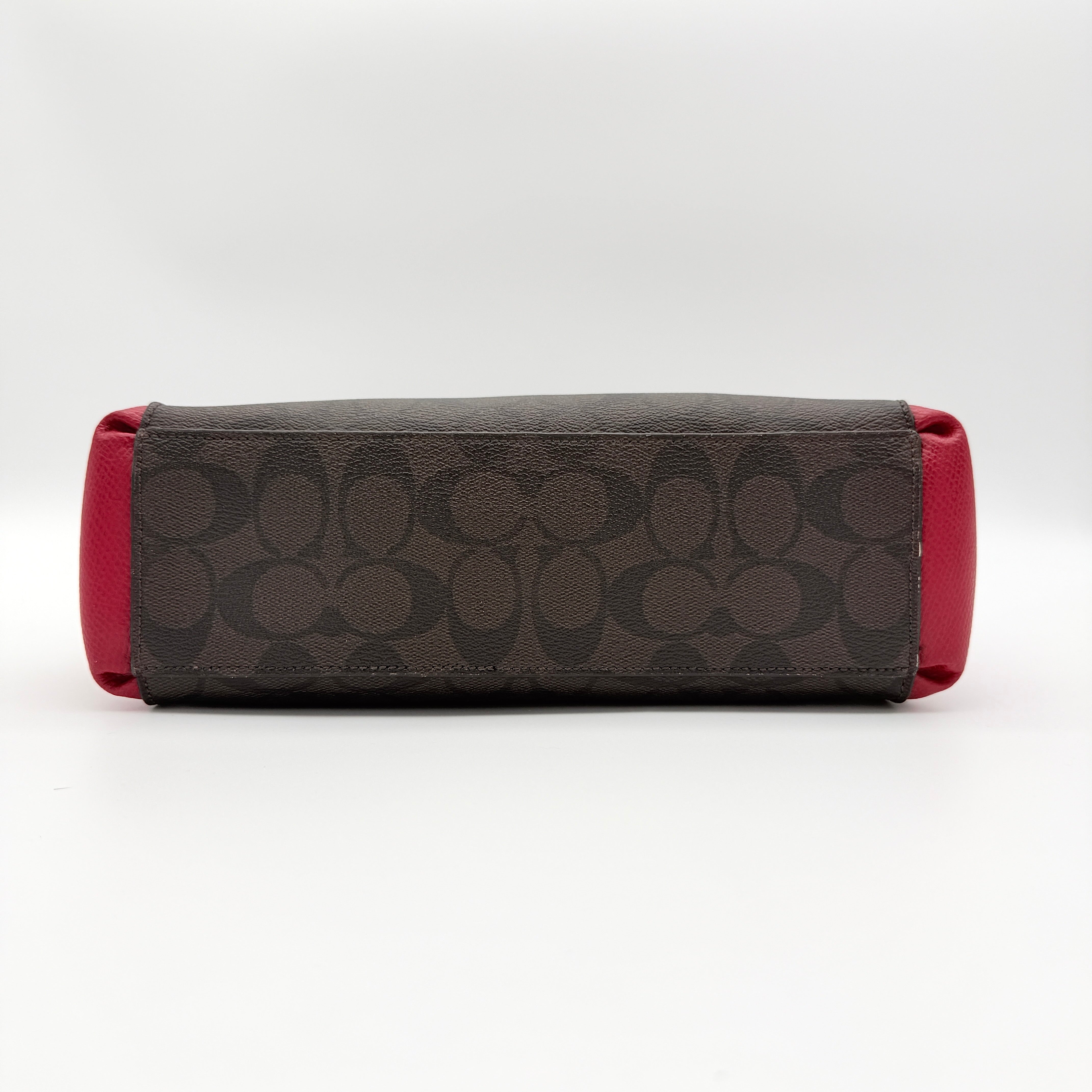 Coach 2Way Christie Carryall in brown coated canvas with red leather handles and sides, gold hardware, shown with detachable strap.