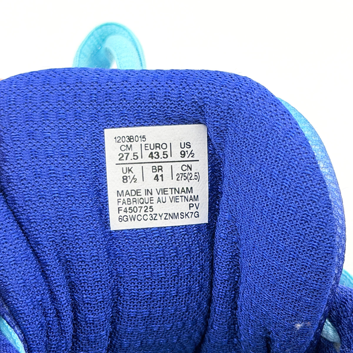 ASICS x KITH Gel-Nimbus 10.1 Mega Man sneakers in bold blue and silver, displayed with extra laces and distinctive collaboration details.