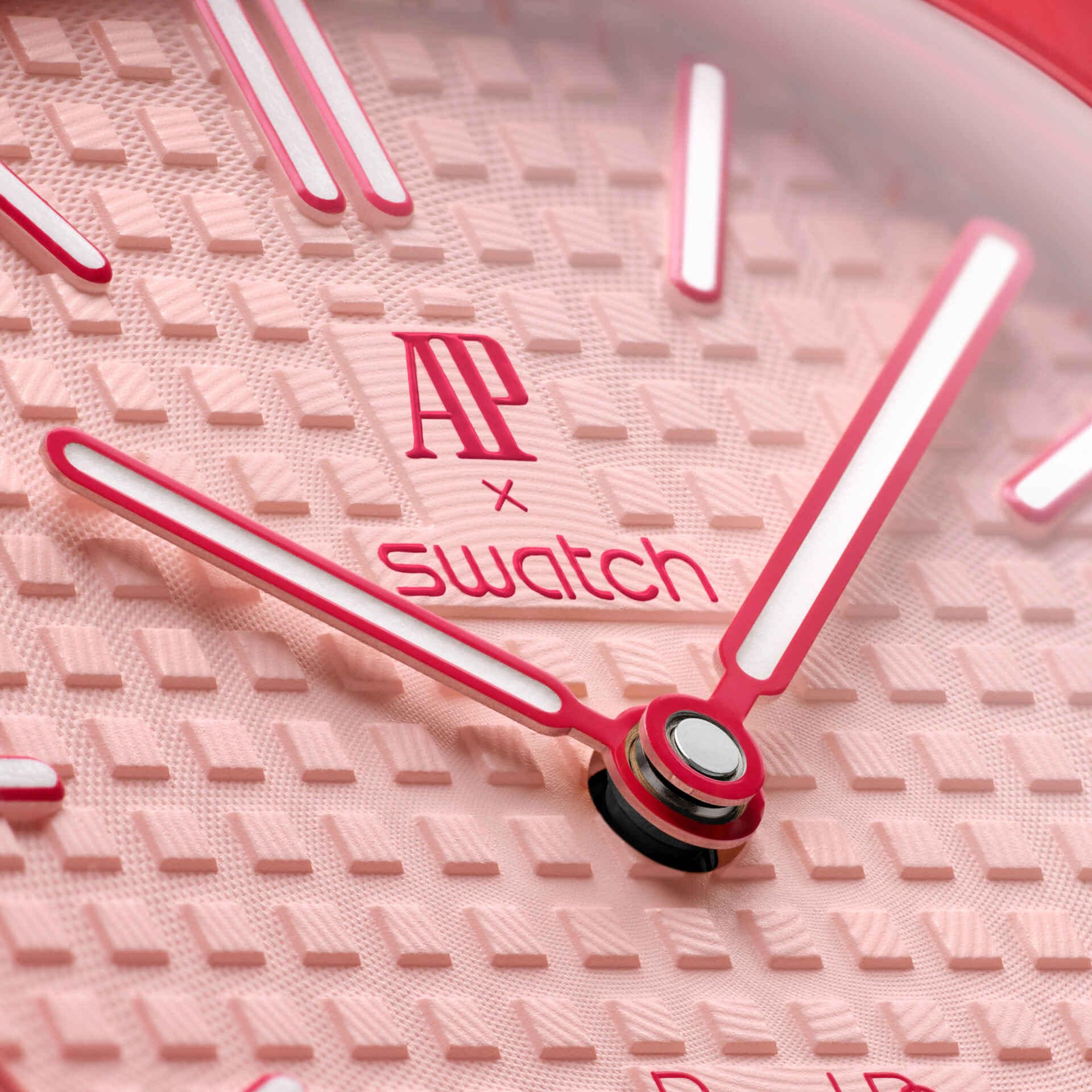 Swatch x Audemars Piguet Royal Pop Otto Rosso pendant watch in pink and red on a soft pink strap, featuring graphic dial details.