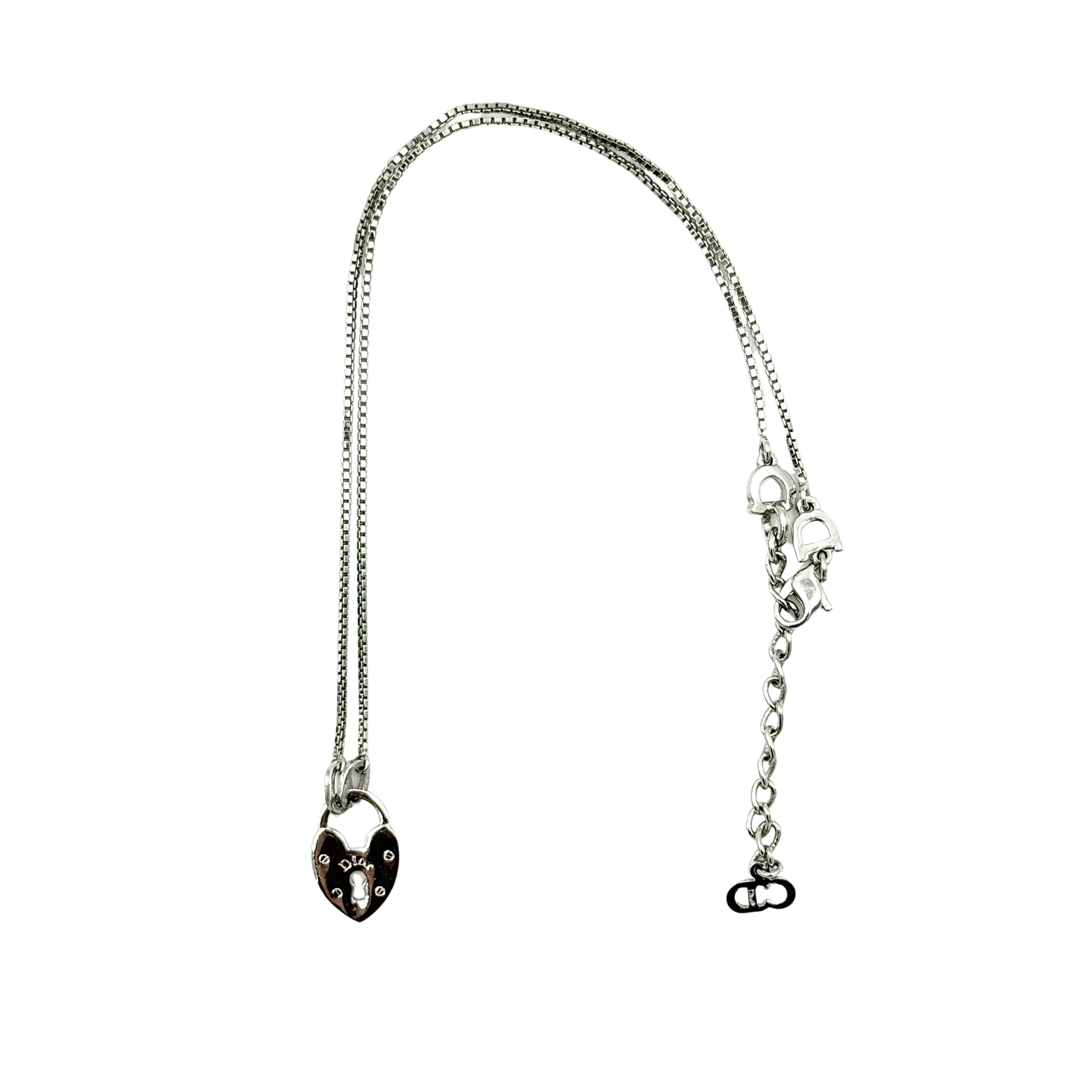 Dior Heart Padlock Necklace in polished silver-tone metal, featuring a heart-shaped padlock pendant on a slender box chain.